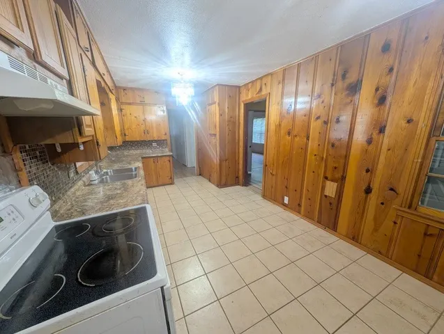 a bathroom with a sink a mirror and shower