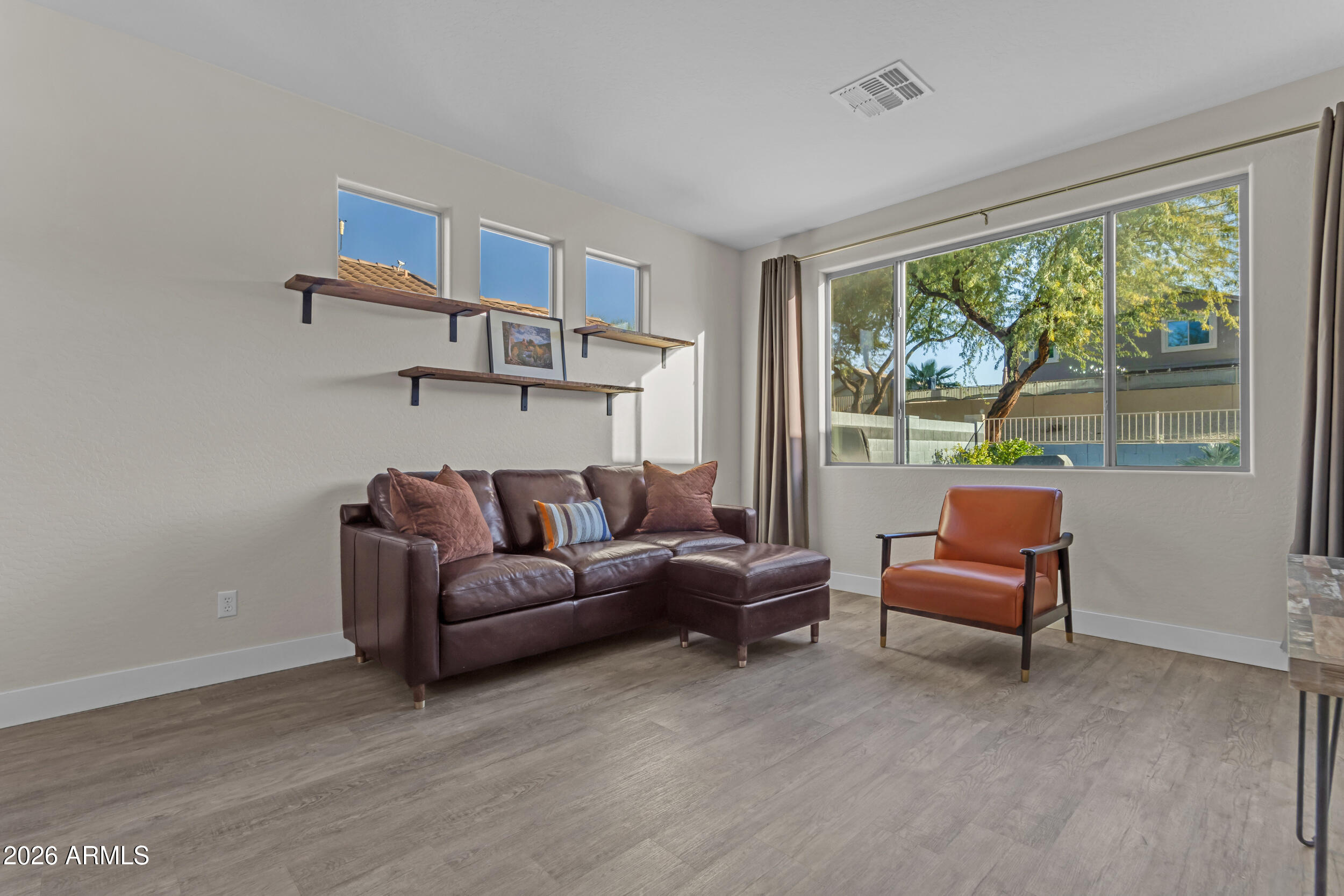 18115 West Cardinal Drive Goodyear, AZ 85338 - Photo 18 of 88 a living room with furniture and a window