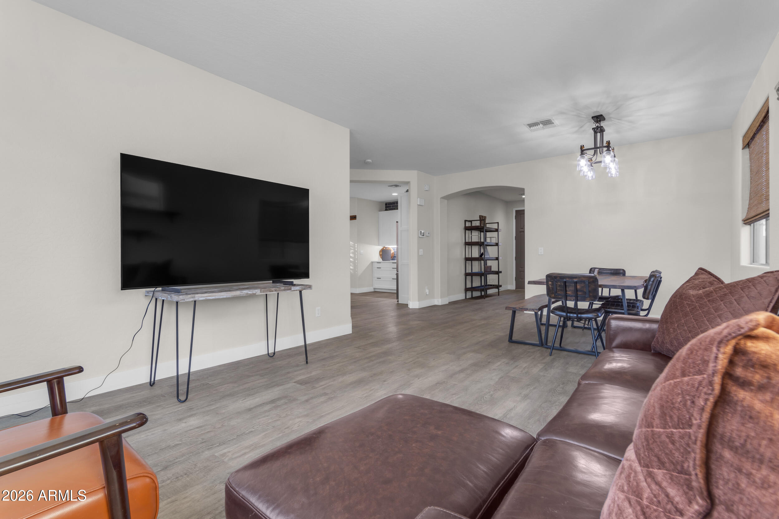 18115 West Cardinal Drive Goodyear, AZ 85338 - Photo 20 of 88 a living room with furniture and a flat screen tv