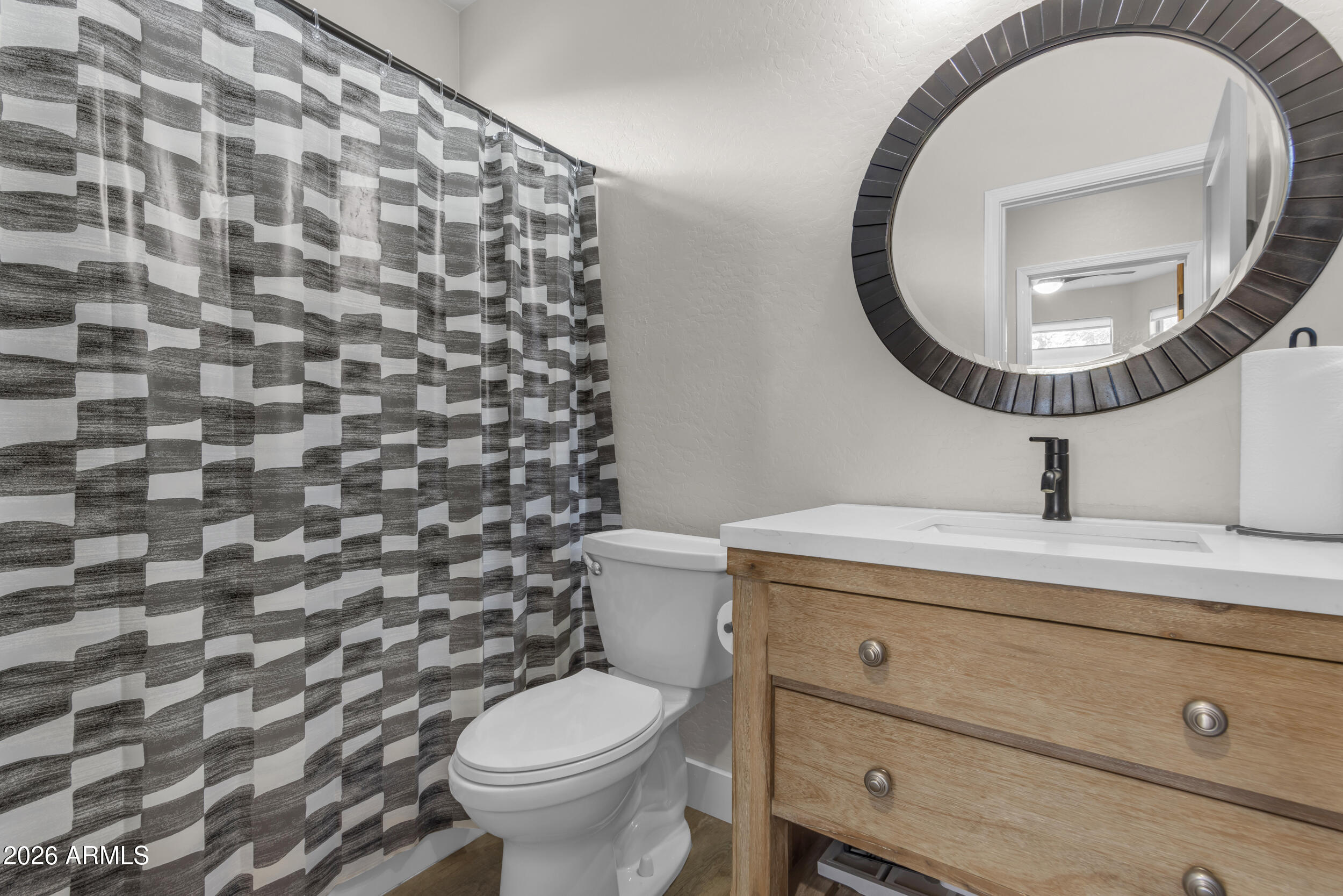 18115 West Cardinal Drive Goodyear, AZ 85338 - Photo 21 of 88 a bathroom with a granite countertop toilet and a sink