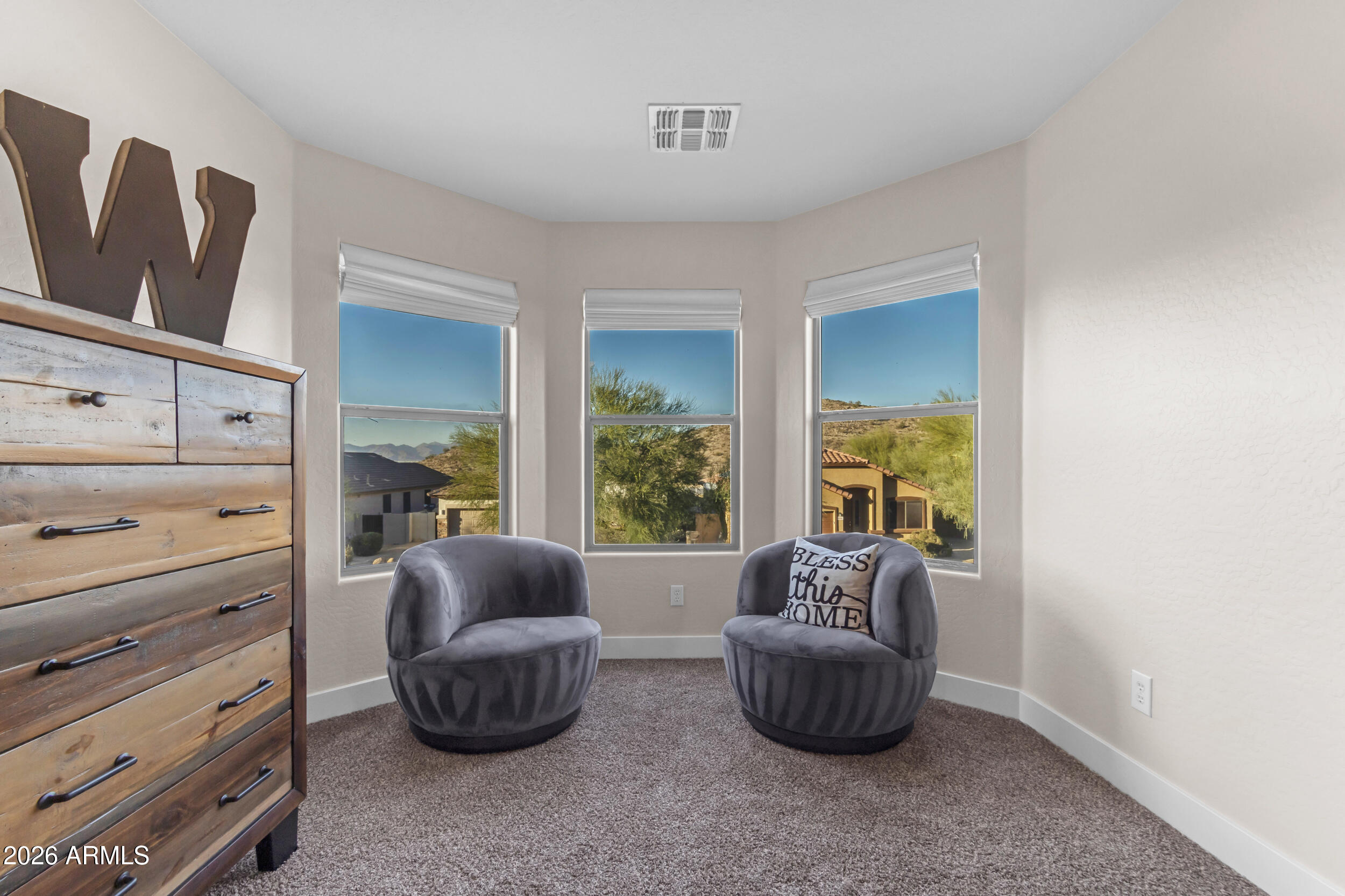 18115 West Cardinal Drive Goodyear, AZ 85338 - Photo 26 of 88 a living room with furniture and a window