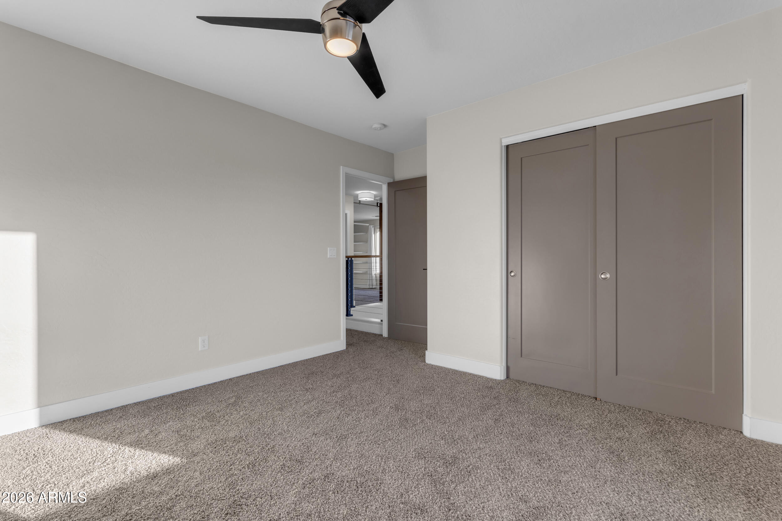 18115 West Cardinal Drive Goodyear, AZ 85338 - Photo 34 of 88 a view of a room with a ceiling fan
