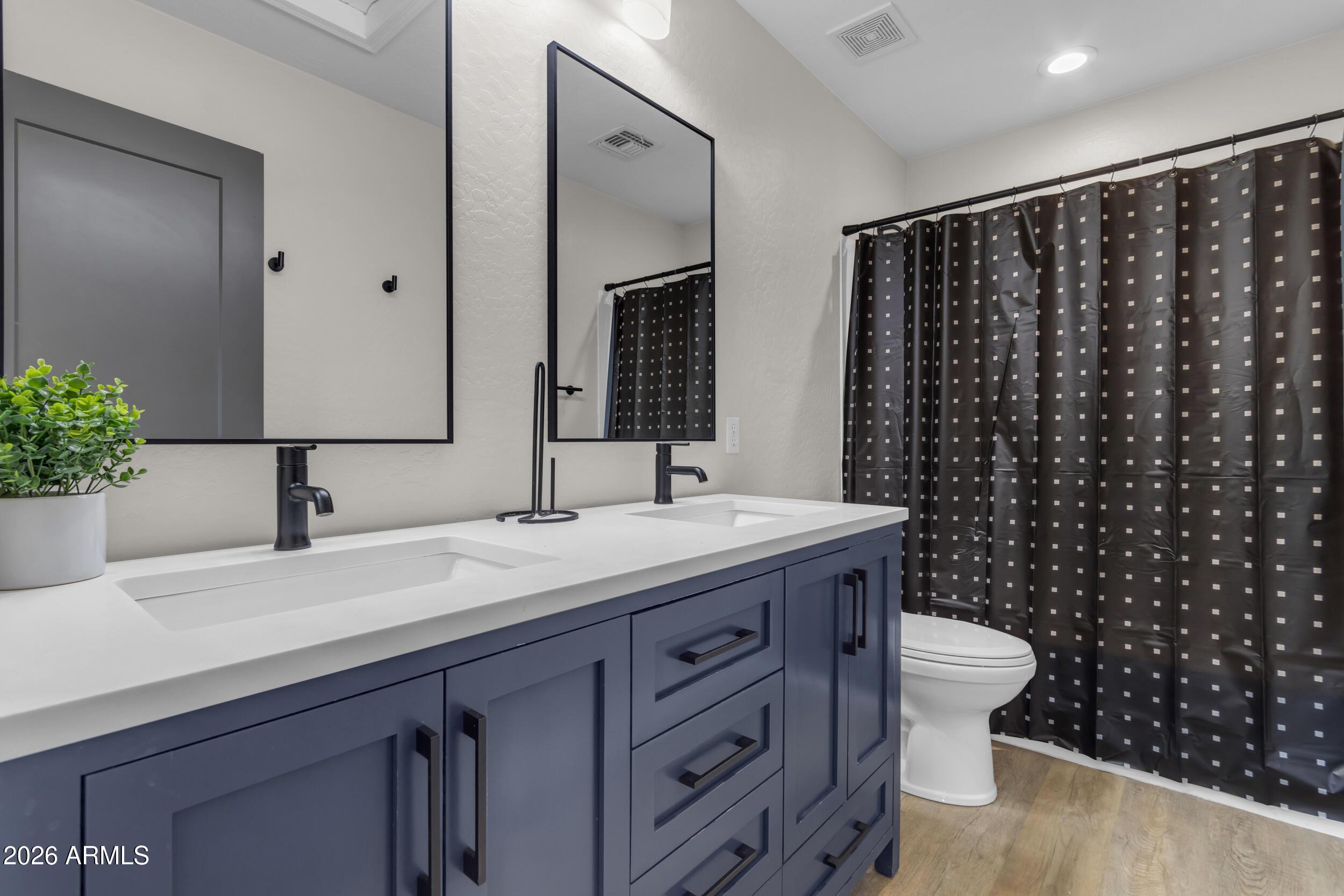 18115 West Cardinal Drive Goodyear, AZ 85338 - Photo 35 of 88 a bathroom with a granite countertop sink and a mirror