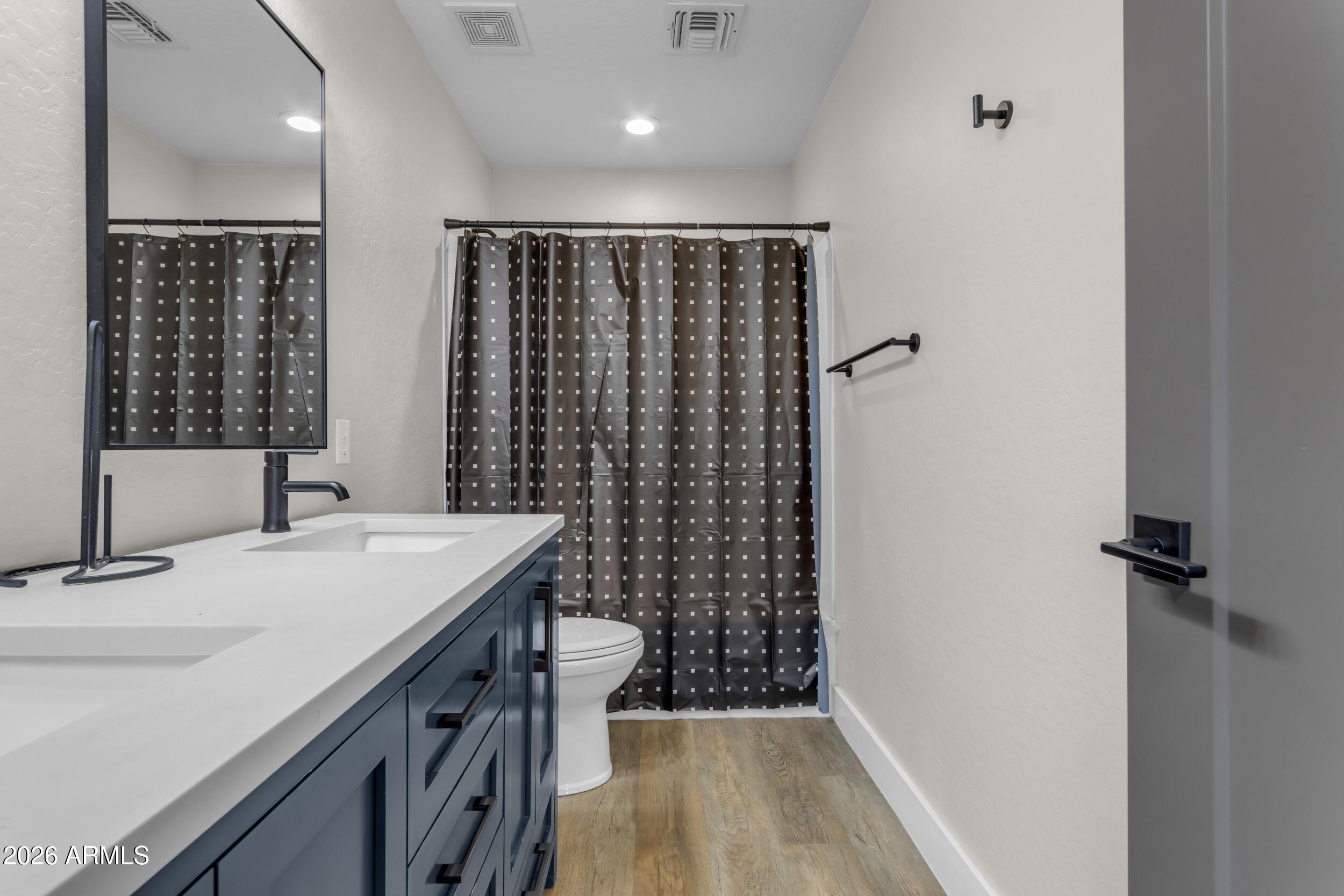 18115 West Cardinal Drive Goodyear, AZ 85338 - Photo 36 of 88 a bathroom with a sink a toilet and shower