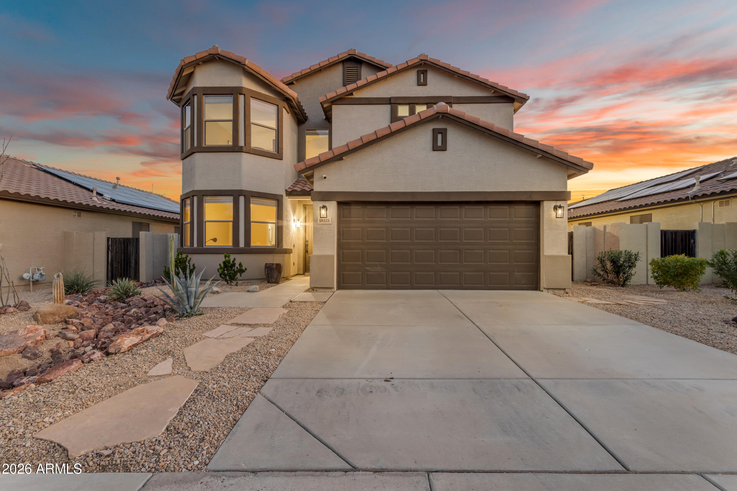 18115 West Cardinal Drive Goodyear, AZ 85338 - Photo 44 of 88 a front view of a house with a yard