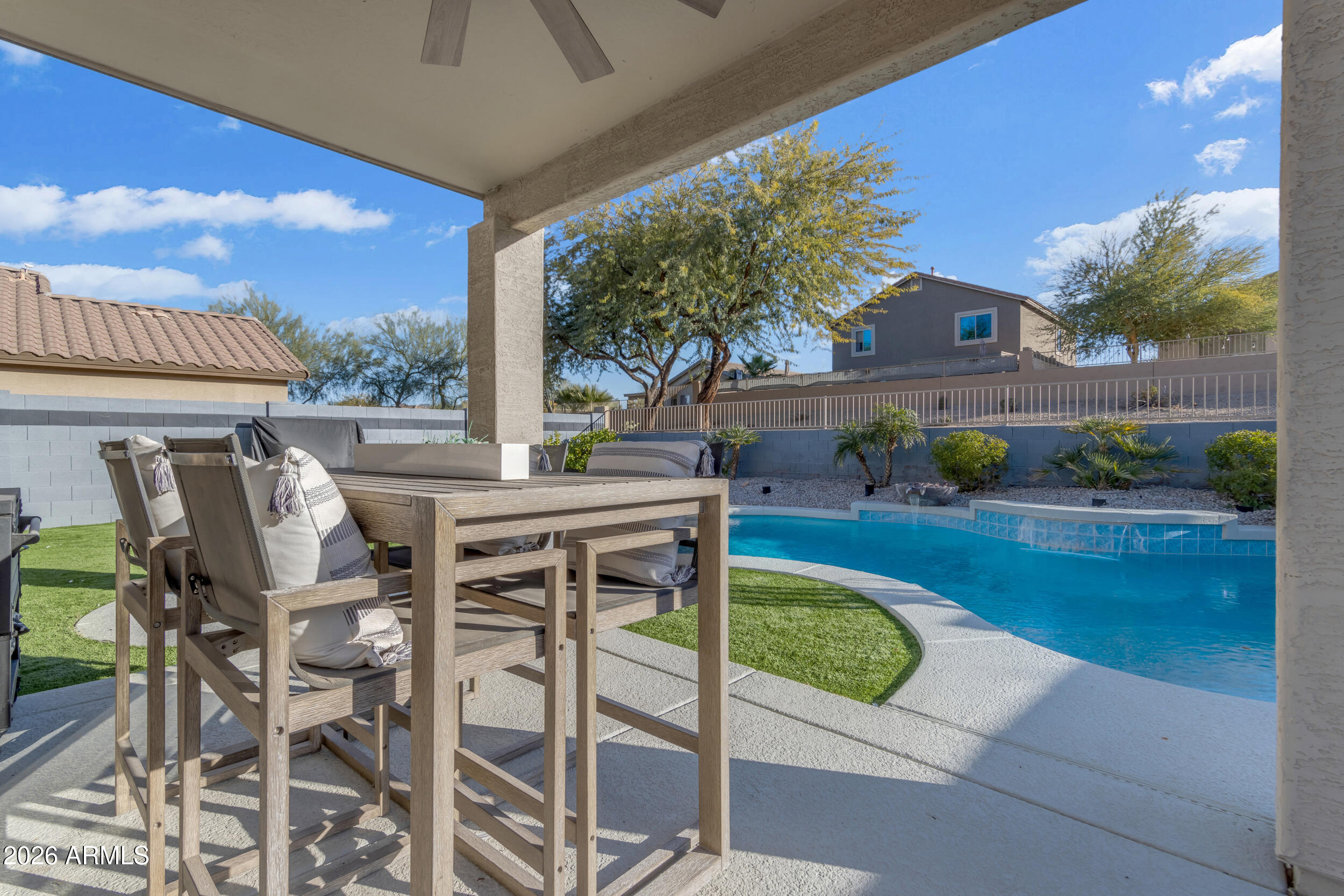 18115 West Cardinal Drive Goodyear, AZ 85338 - Photo 48 of 88 a view of a patio with table and chairs and potted plants