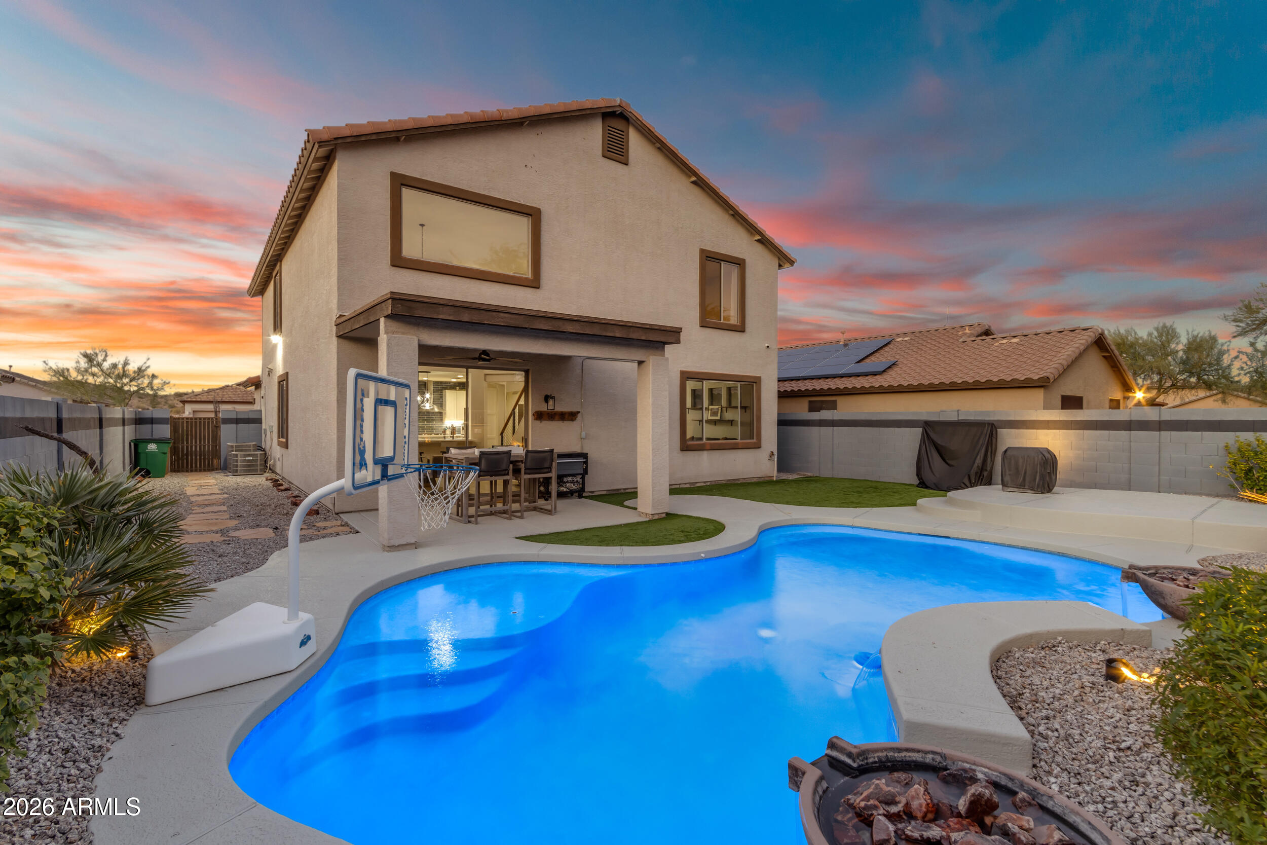 18115 West Cardinal Drive Goodyear, AZ 85338 - Photo 3 of 88 a view of a patio with swimming pool table and chairs