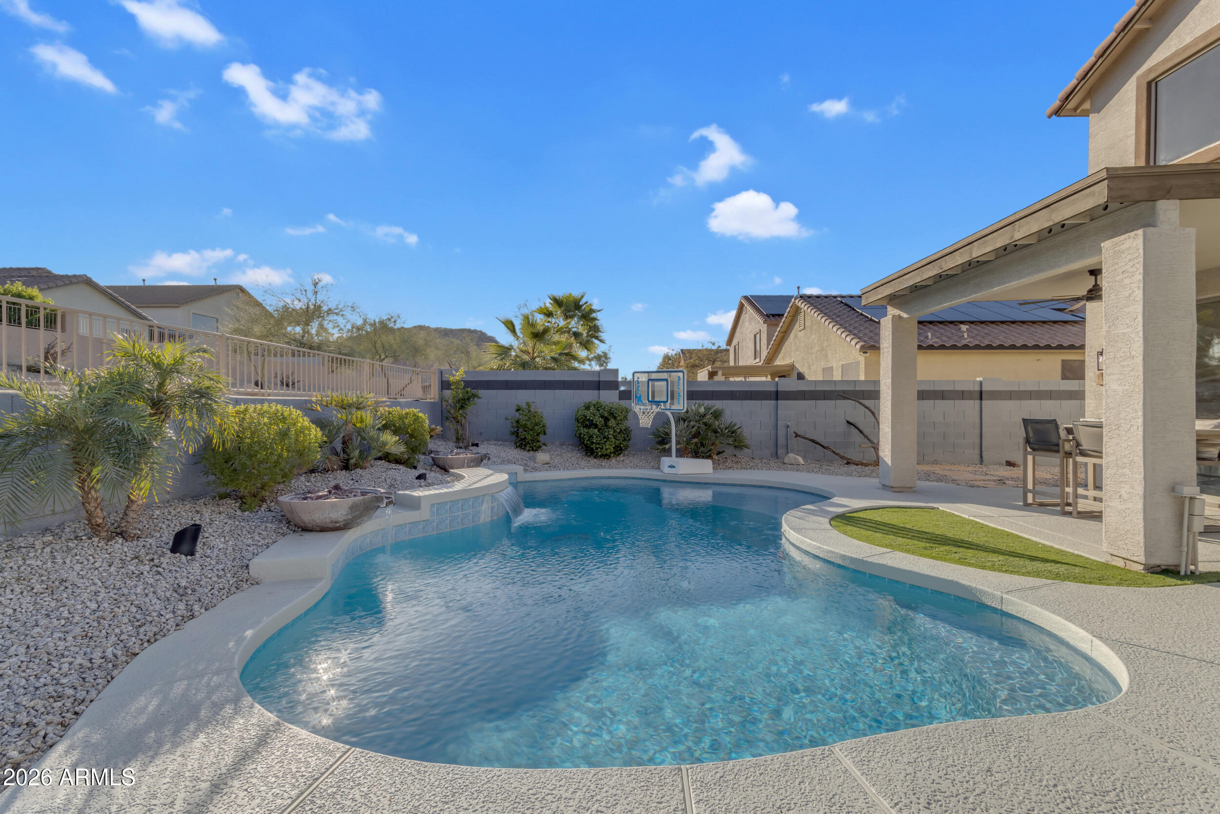 18115 West Cardinal Drive Goodyear, AZ 85338 - Photo 53 of 88 a view of a swimming pool with a patio and a yard