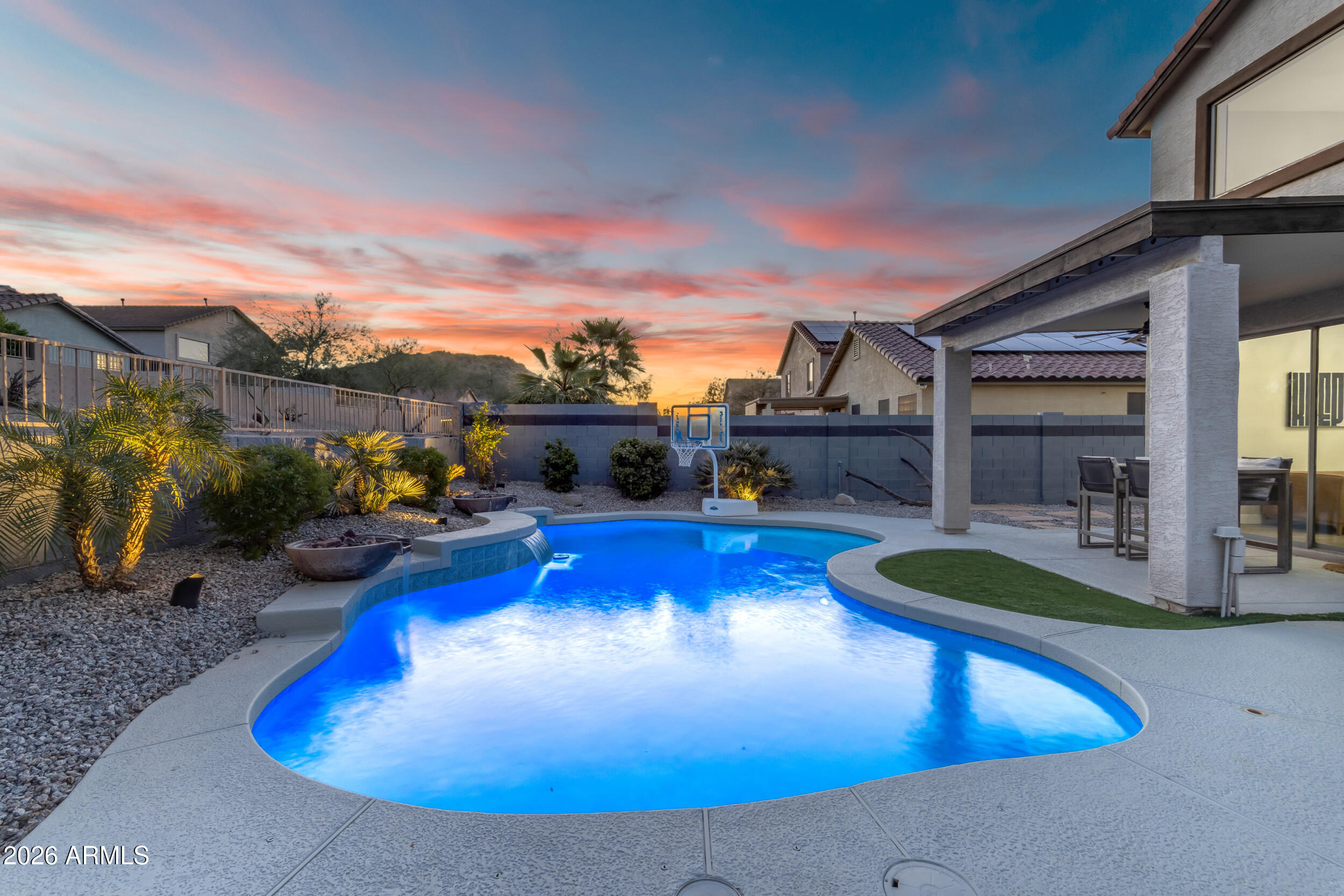 18115 West Cardinal Drive Goodyear, AZ 85338 - Photo 58 of 88 a view of a swimming pool with lounge chairs