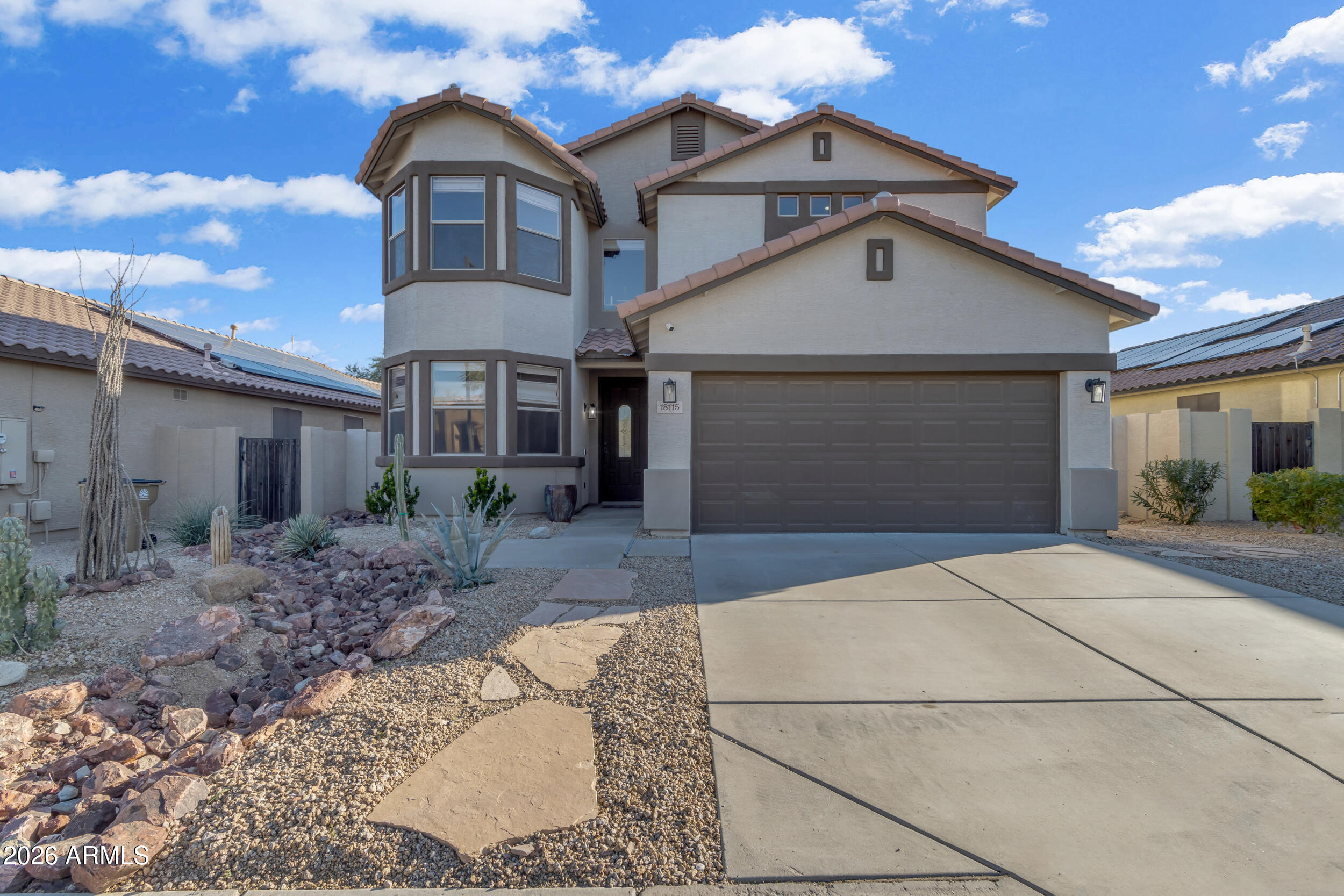 18115 West Cardinal Drive Goodyear, AZ 85338 - Photo 64 of 88 a front view of a house with garden