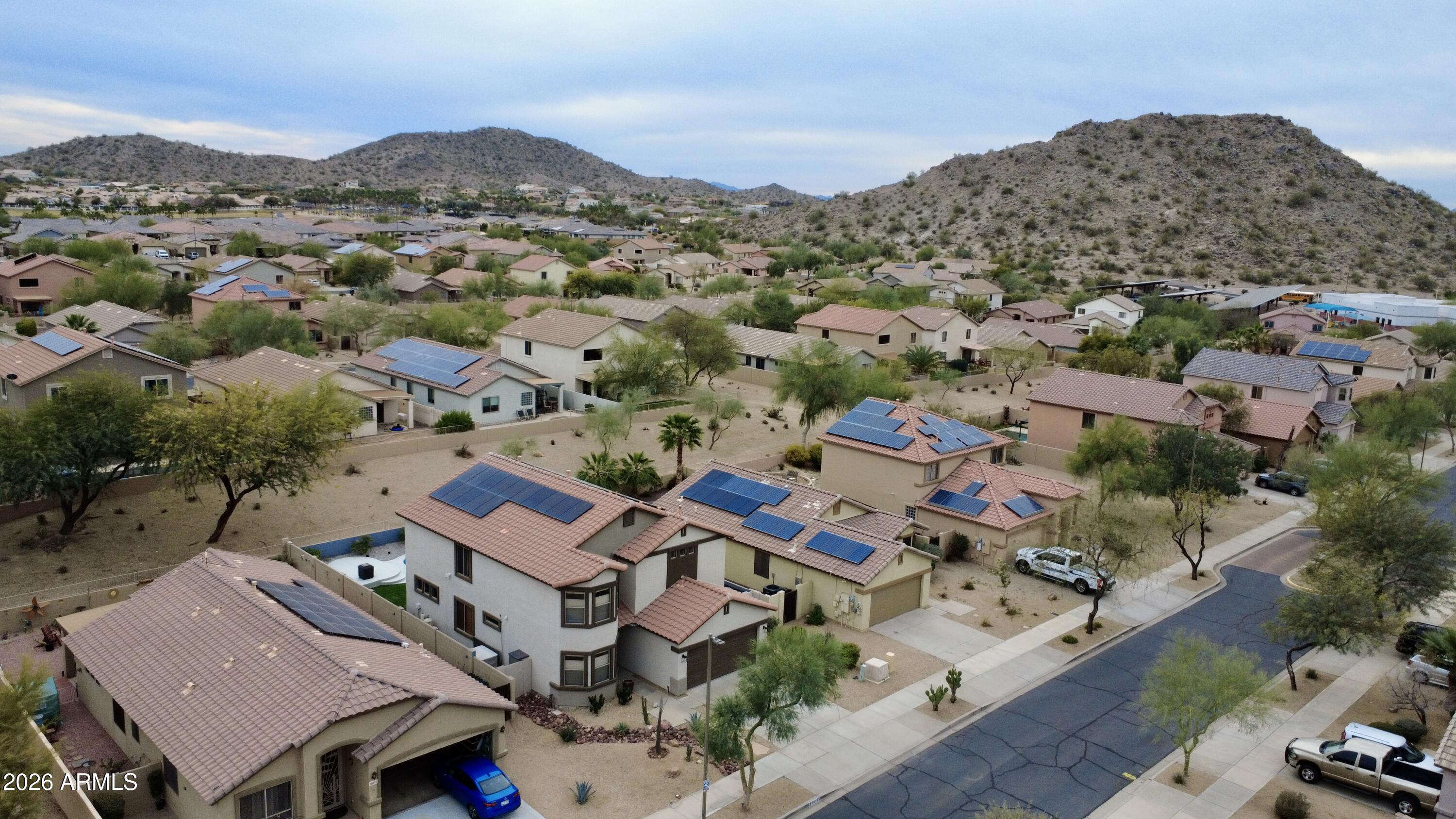 18115 West Cardinal Drive Goodyear, AZ 85338 - Photo 70 of 88 an aerial view of residential houses with outdoor space