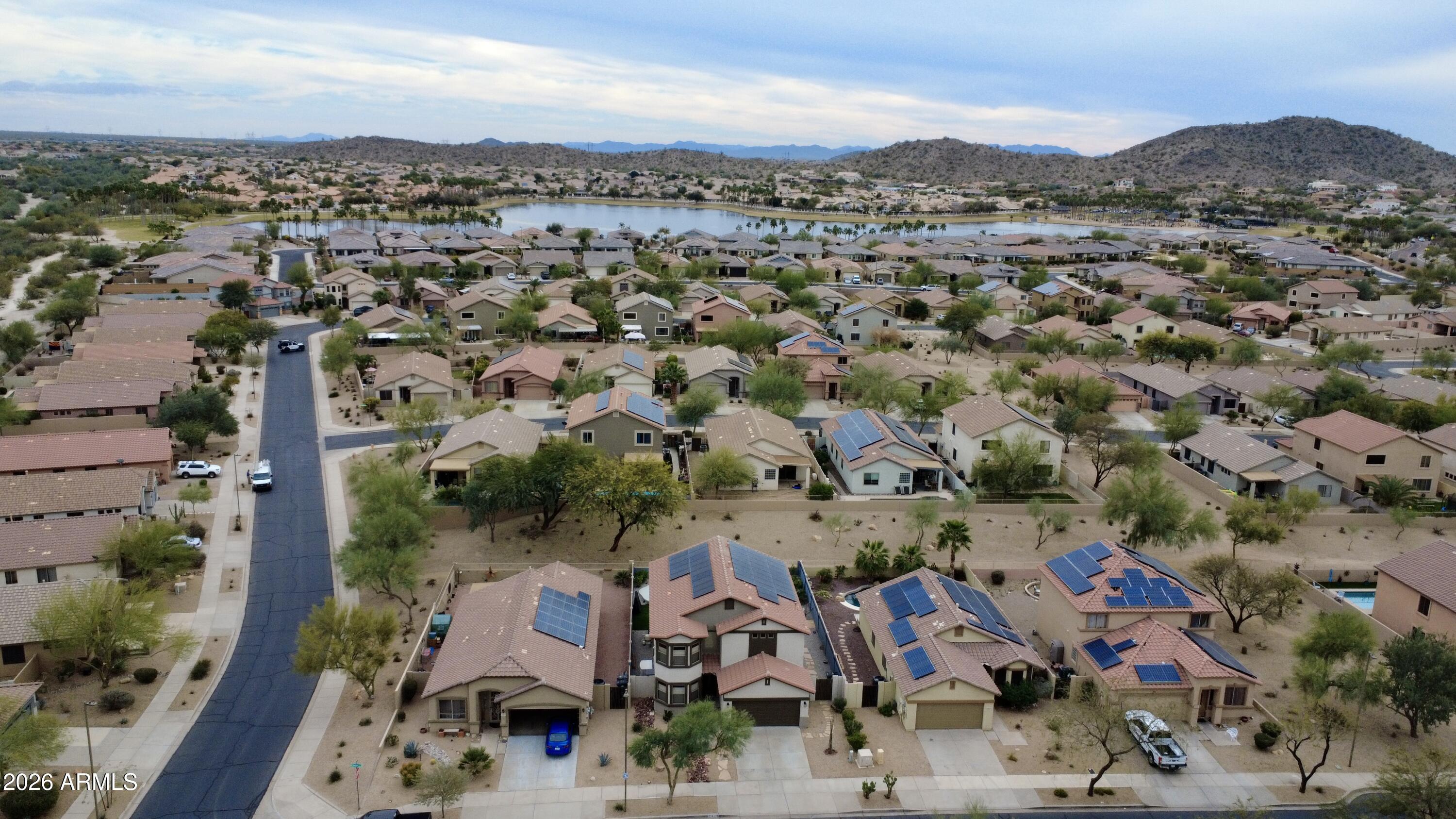 18115 West Cardinal Drive Goodyear, AZ 85338 - Photo 72 of 88 an aerial view of residential houses with outdoor space