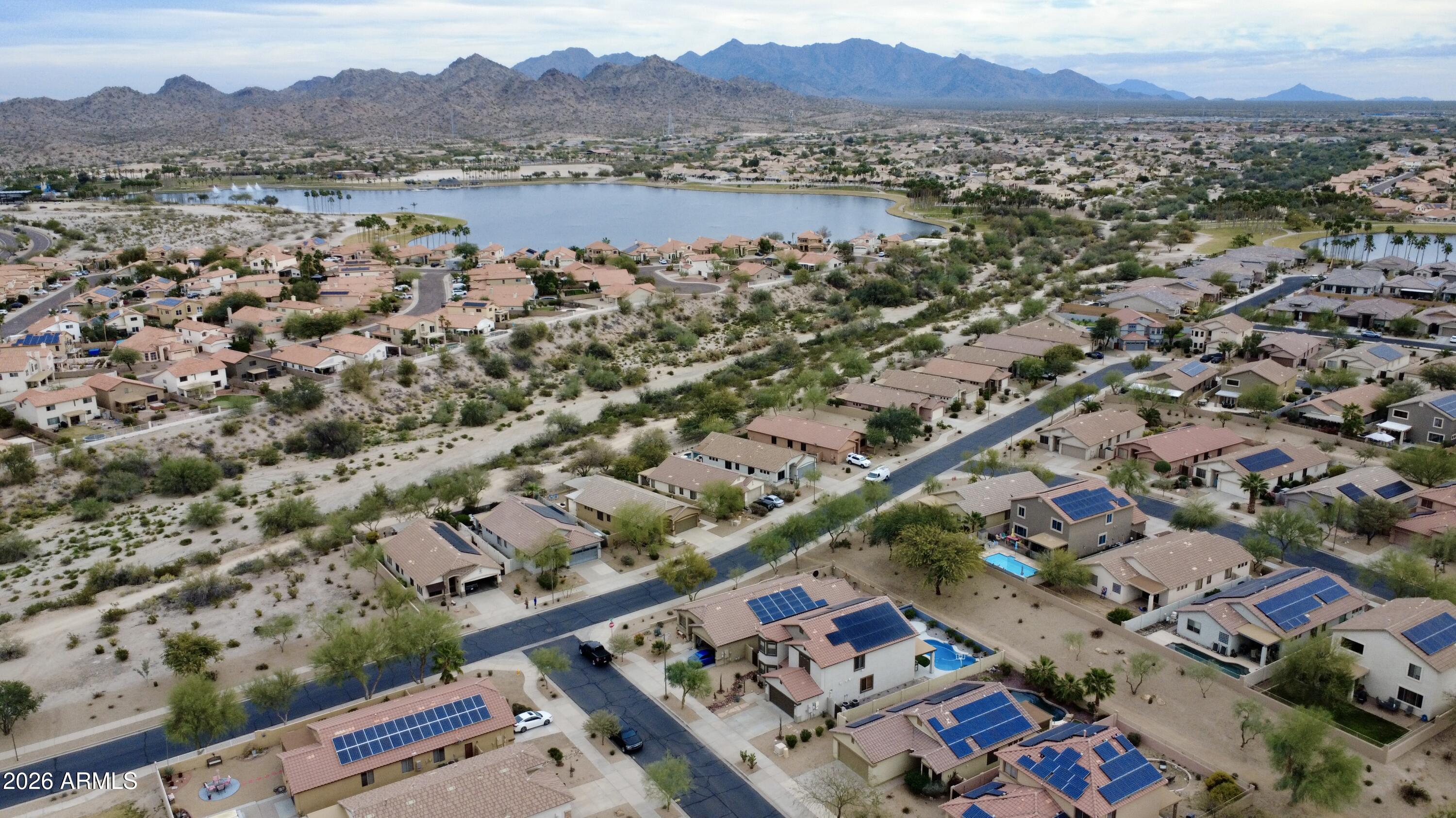 18115 West Cardinal Drive Goodyear, AZ 85338 - Photo 73 of 88 an aerial view of a city with lots of residential buildings