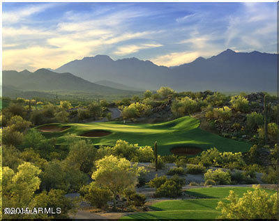 18115 West Cardinal Drive Goodyear, AZ 85338 - Photo 82 of 88 a view of a lake with a mountain in the background