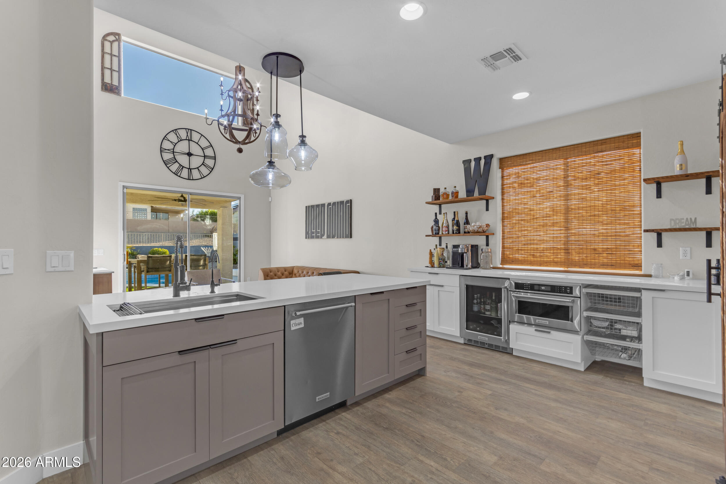 18115 West Cardinal Drive Goodyear, AZ 85338 - Photo 7 of 88 a view of kitchen with stainless steel appliances granite countertop a stove and a sink with cabinets