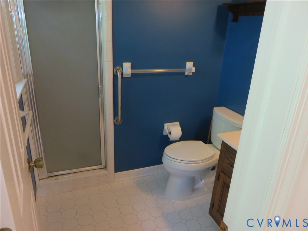 8379 Quailfield Road Mechanicsville, VA 23116 - Photo 41 of 56 a white toilet sitting next to a bathroom sink