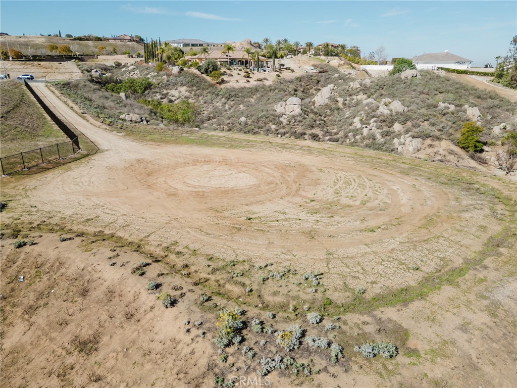7282 Magnon Court Riverside, CA 92506 - Photo 6 of 15 a view of a dry yard with wooden fence