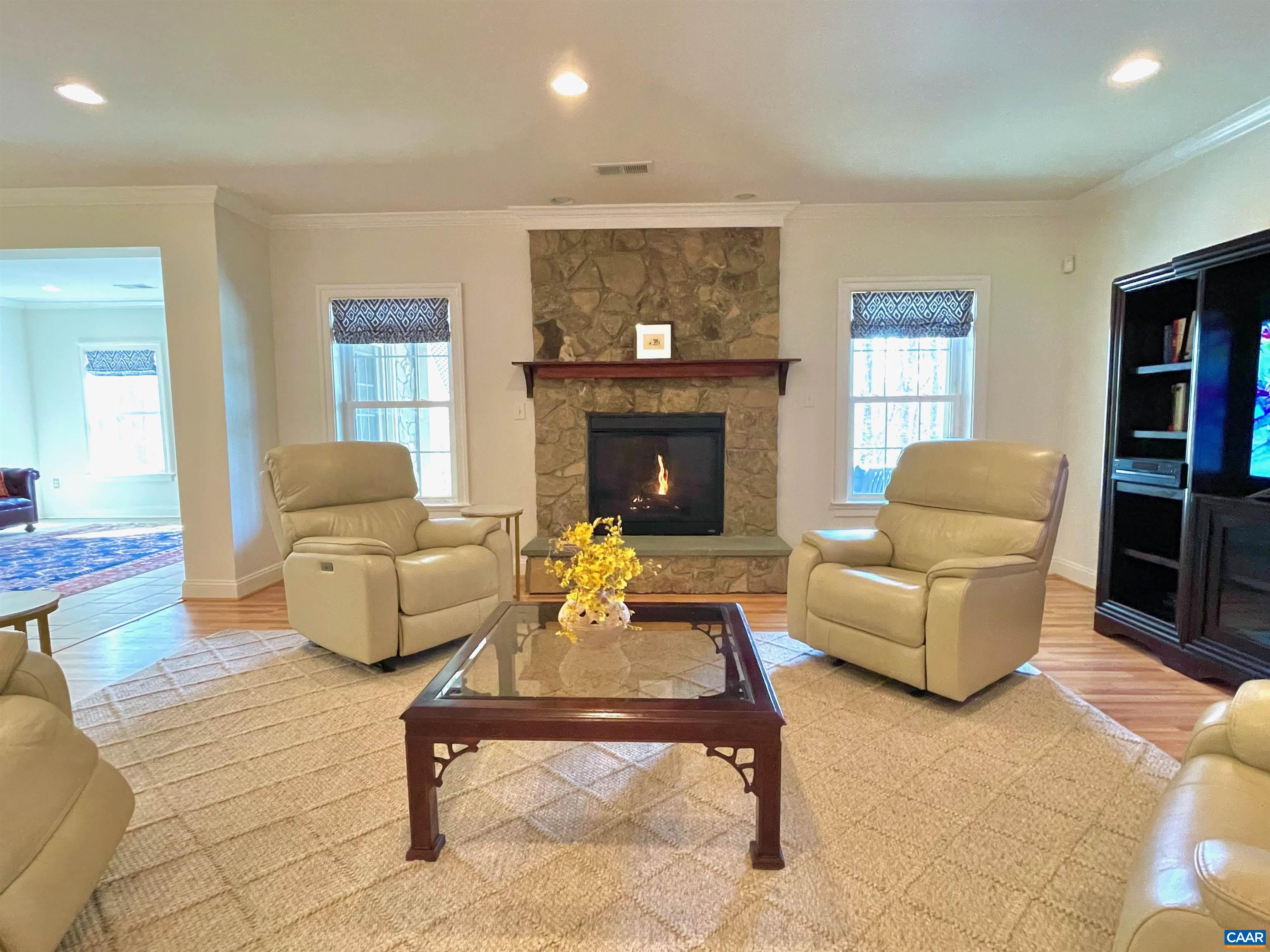 2084 Piper Way Keswick, VA 22947 - Photo 33 of 57 a living room with furniture and a fireplace