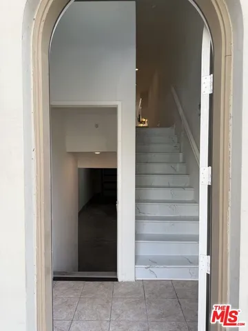 a view of a hallway and chandelier
