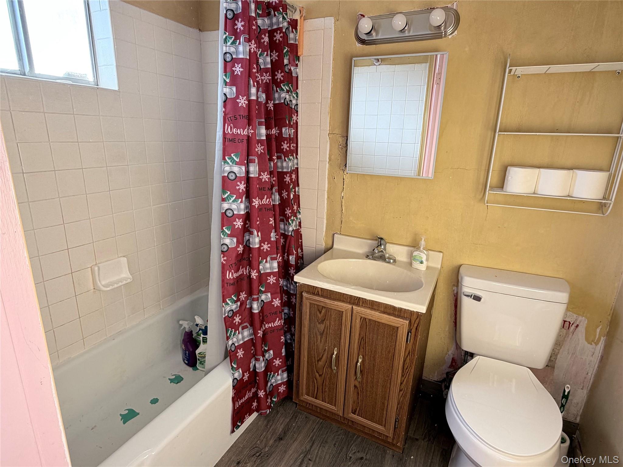 881 Albany Post Road, Unit 21 New Paltz, NY 12561 - Photo 12 of 19 a bathroom with a sink toilet and shower