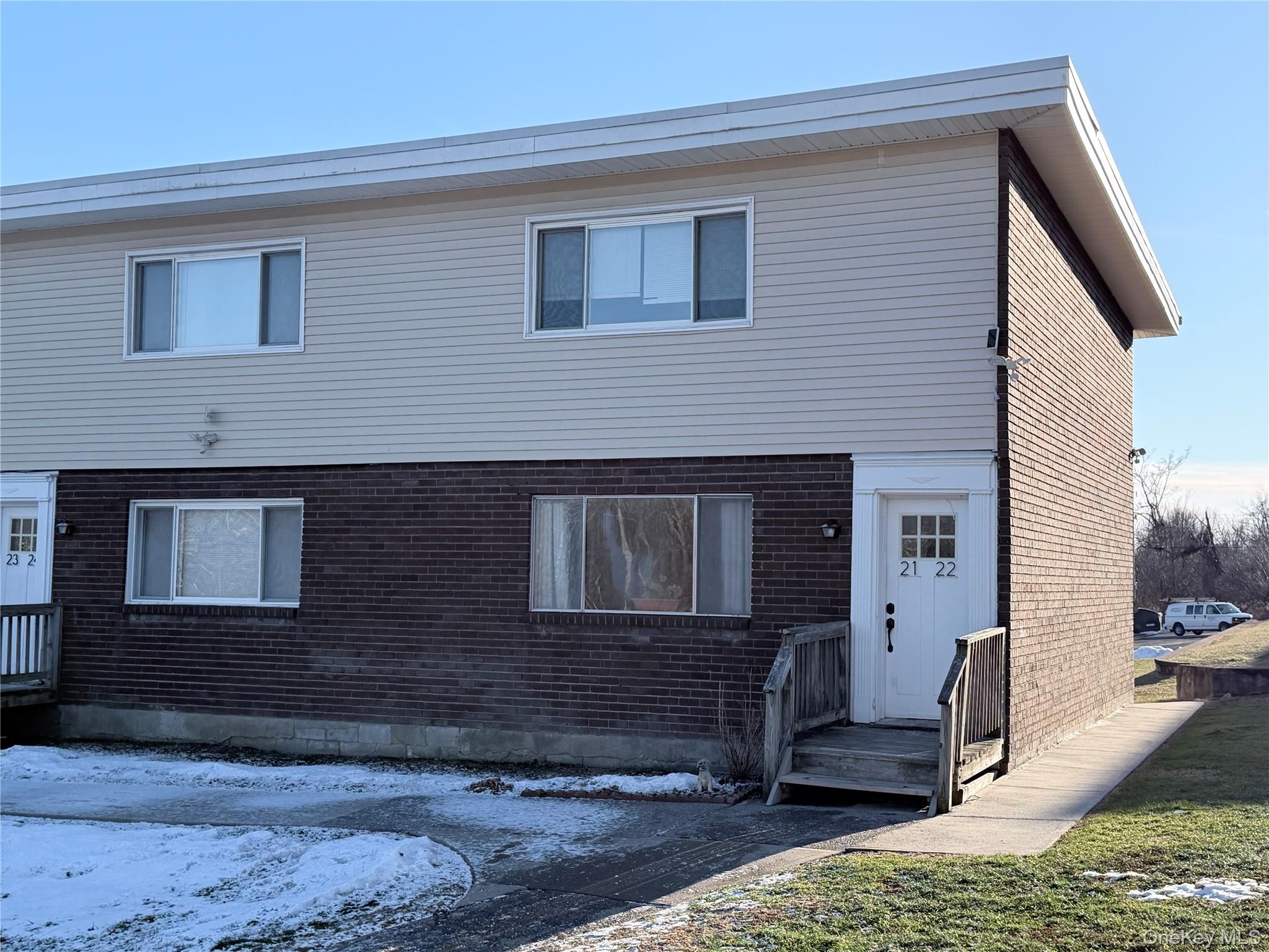 881 Albany Post Road, Unit 21 New Paltz, NY 12561 - Photo 16 of 19 a front view of a house with porch