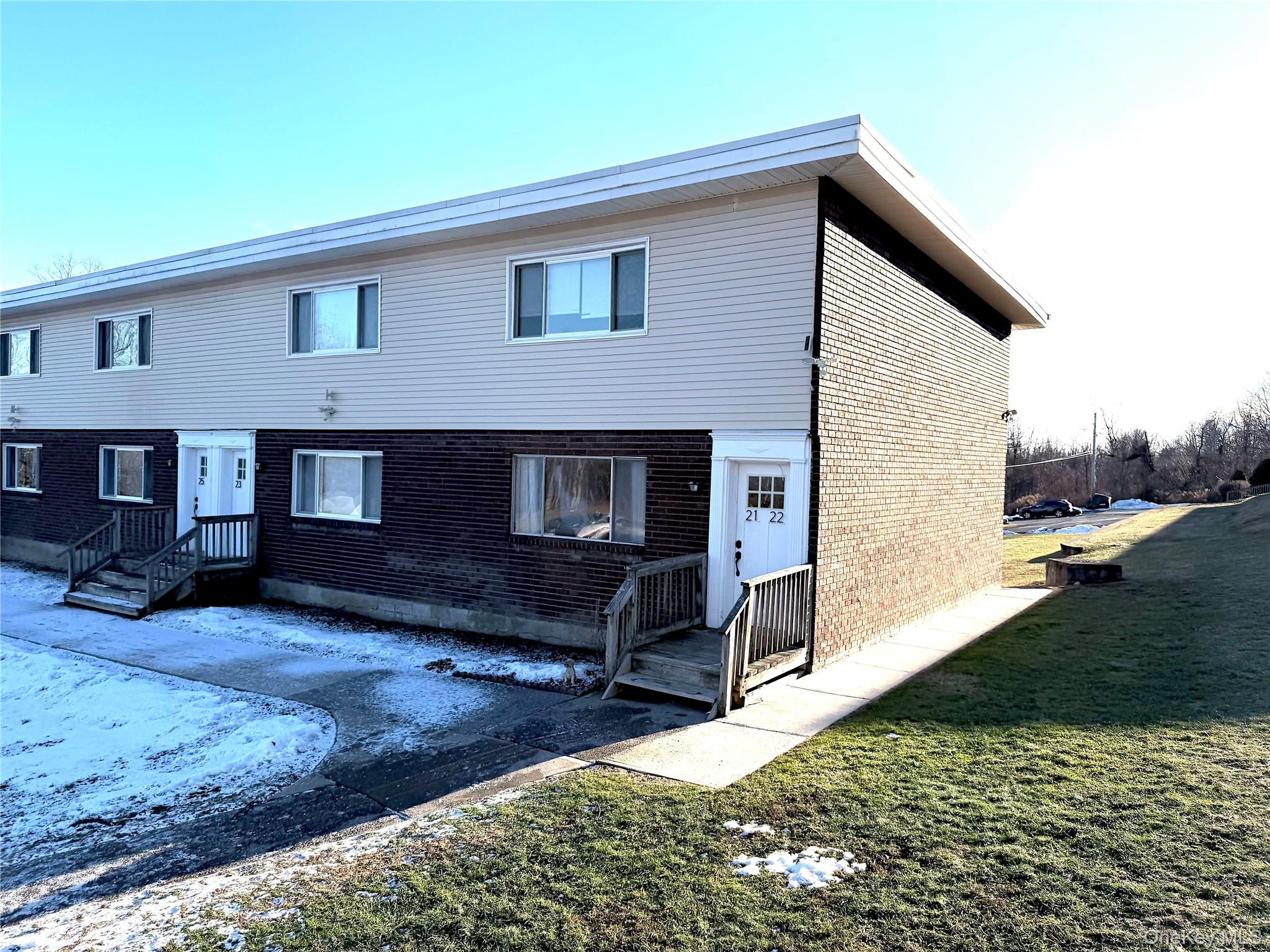 881 Albany Post Road, Unit 21 New Paltz, NY 12561 - Photo 17 of 19 a view of a house with a yard