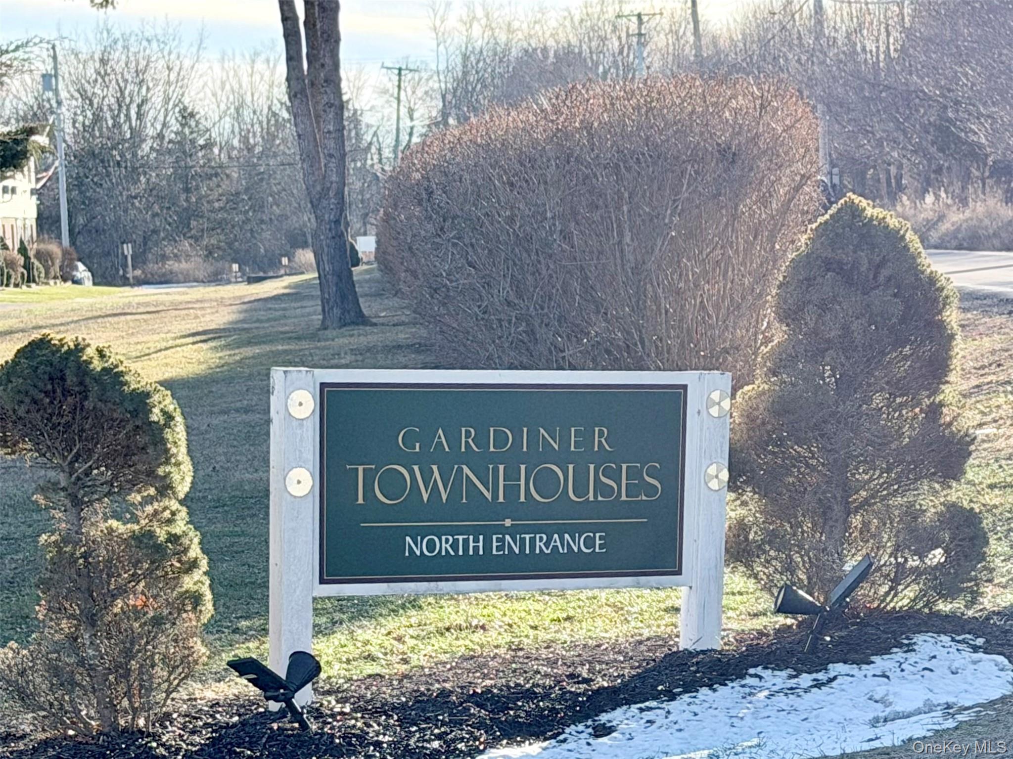 881 Albany Post Road, Unit 21 New Paltz, NY 12561 - Photo 19 of 19 a sign on the side of a building