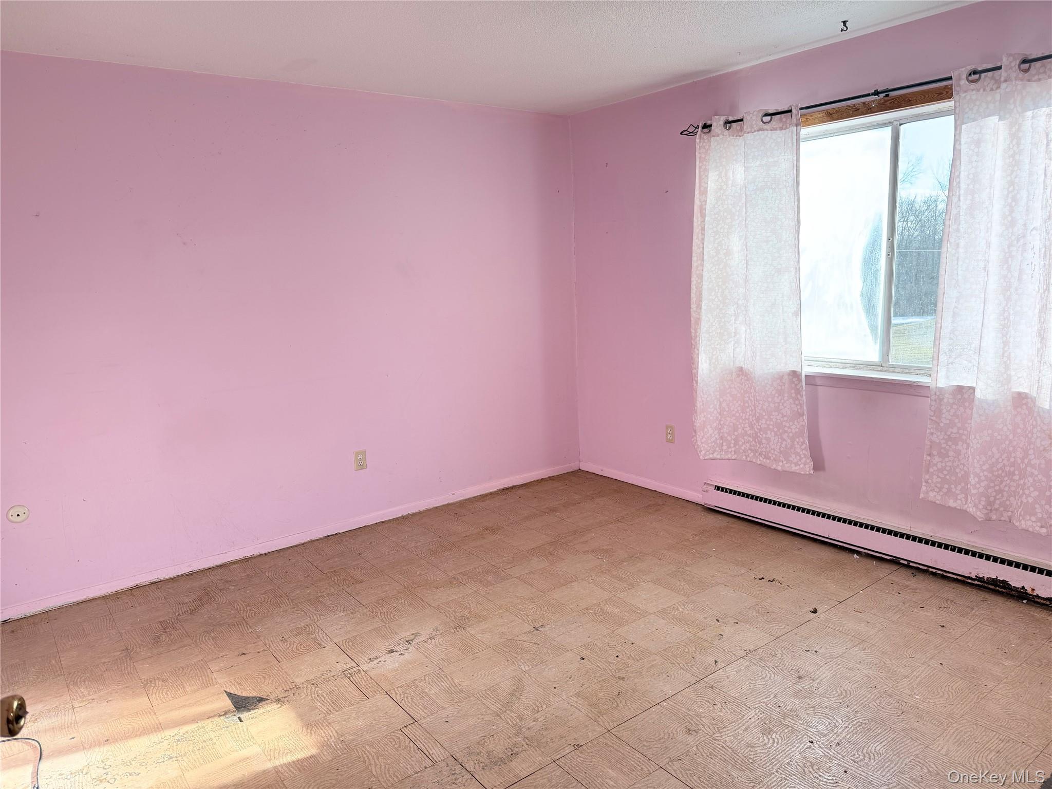 881 Albany Post Road, Unit 21 New Paltz, NY 12561 - Photo 9 of 19 a view of an empty room with a window