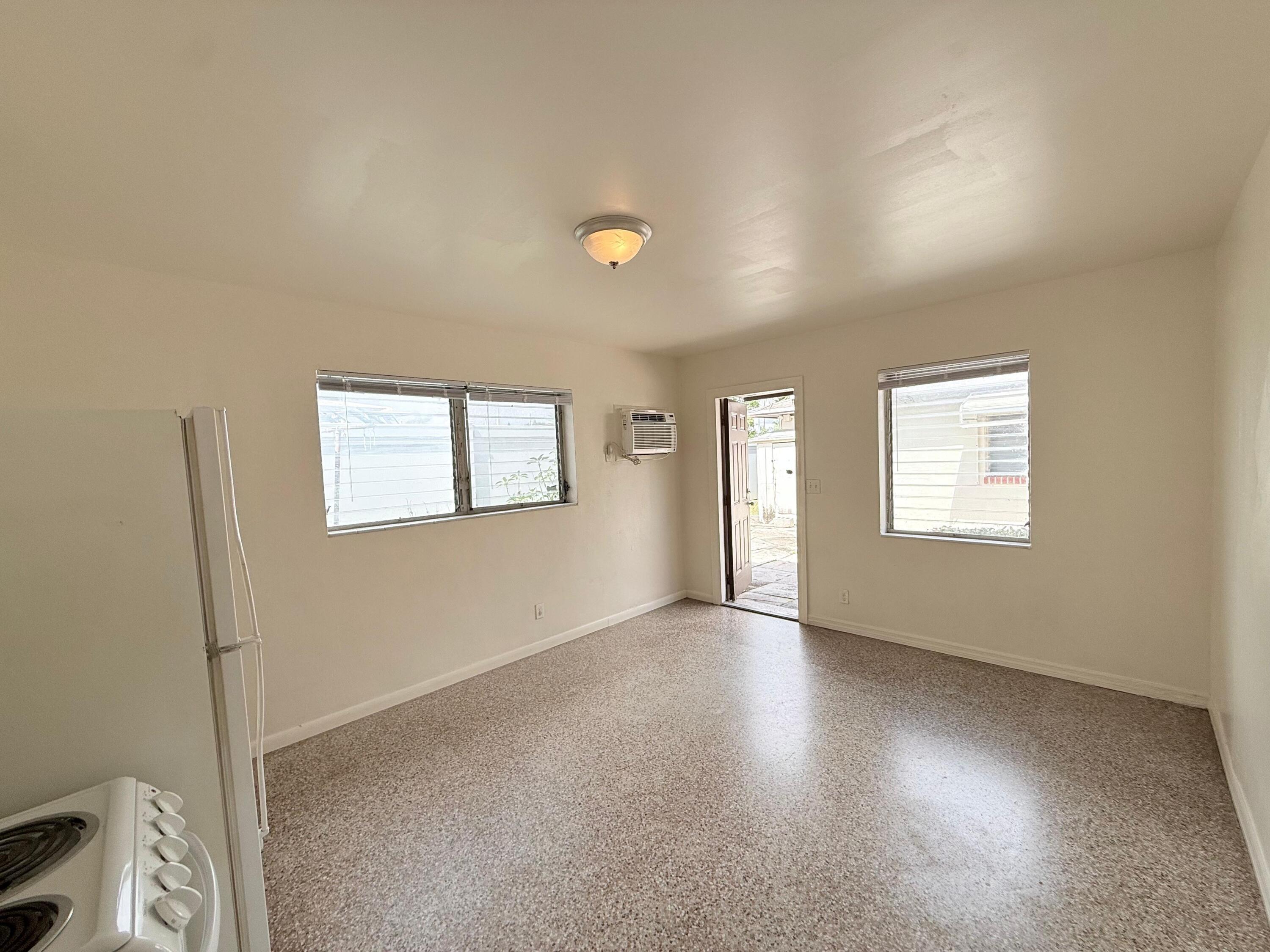 43 East 16th Street, Unit 4 Riviera Beach, FL 33404 - Photo 5 of 7 a view of an empty room with a window