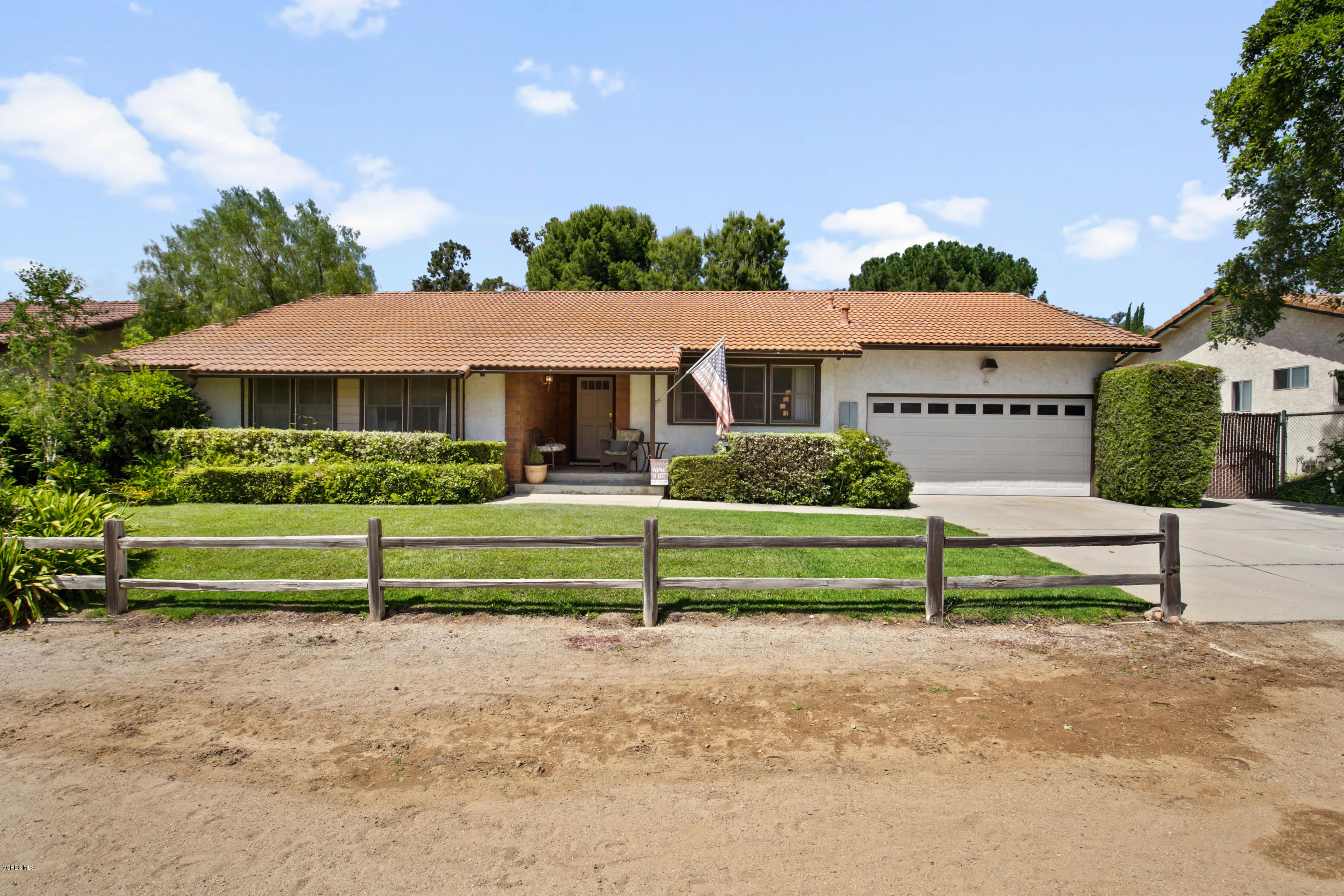 1291 Rambling Road Simi Valley, CA 93065 - Photo 1 of 75 a front view of a house with a yard