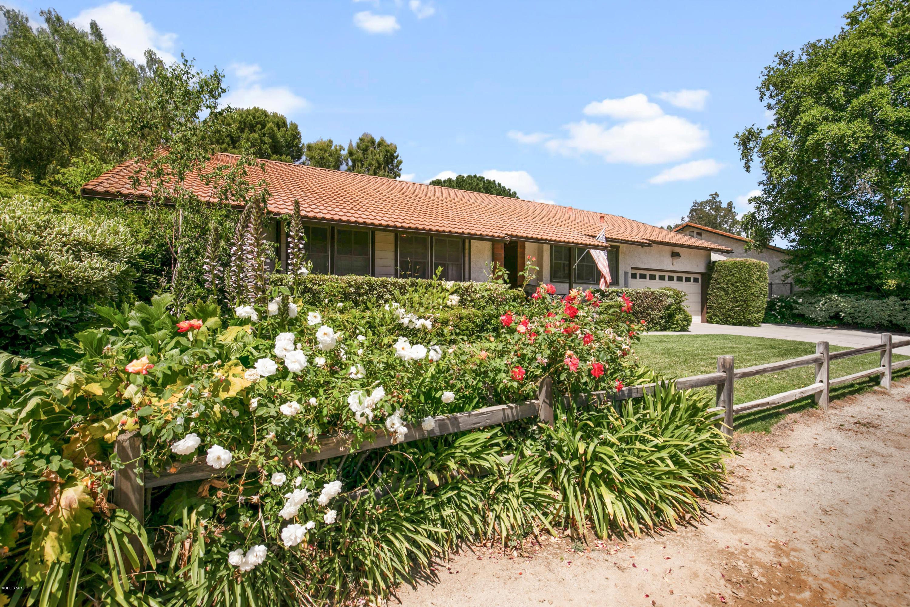 1291 Rambling Road Simi Valley, CA 93065 - Photo 2 of 75 a view of a house with a yard and garden
