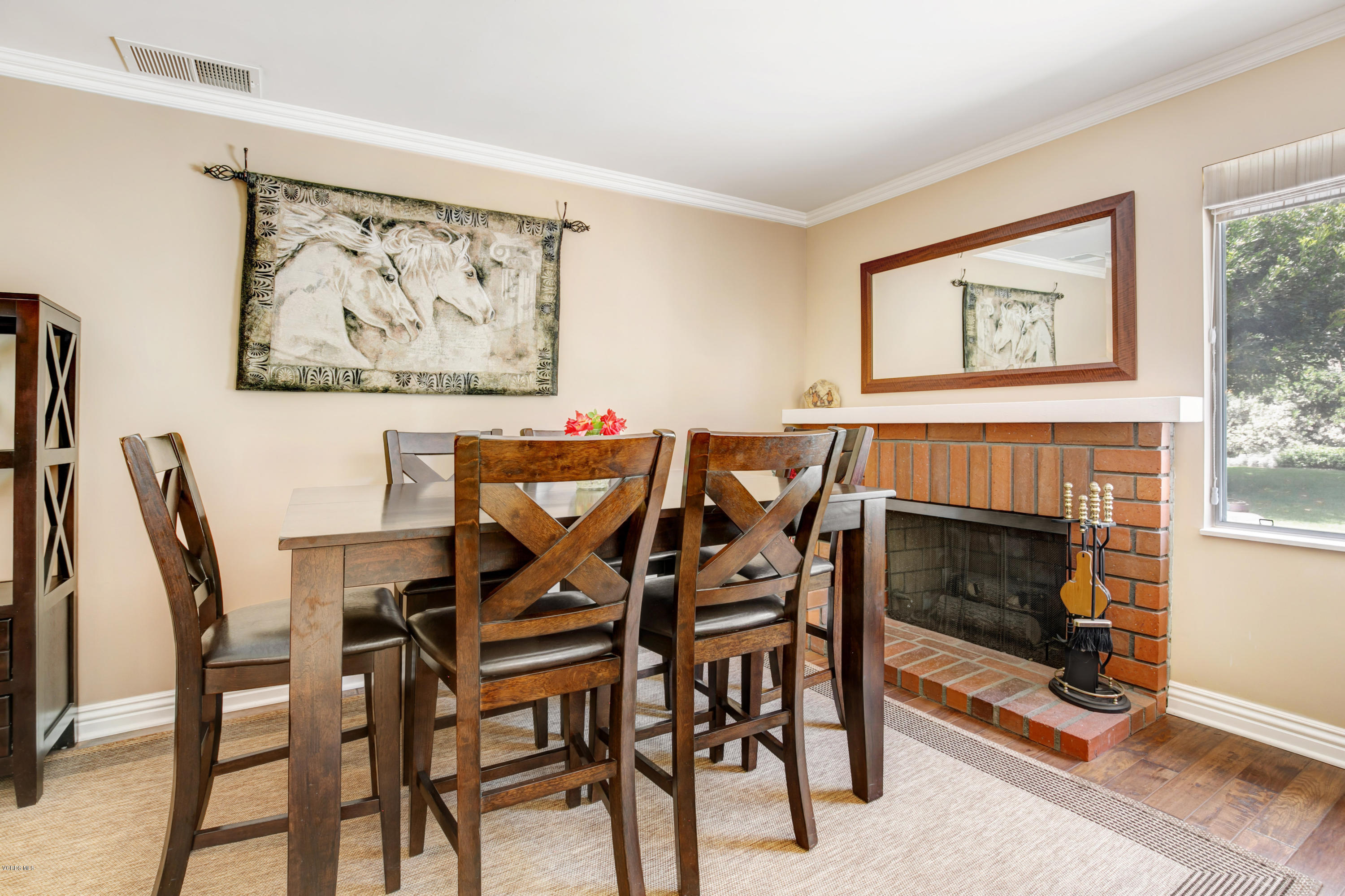 1291 Rambling Road Simi Valley, CA 93065 - Photo 14 of 75 a view of a dining room with furniture and a fireplace