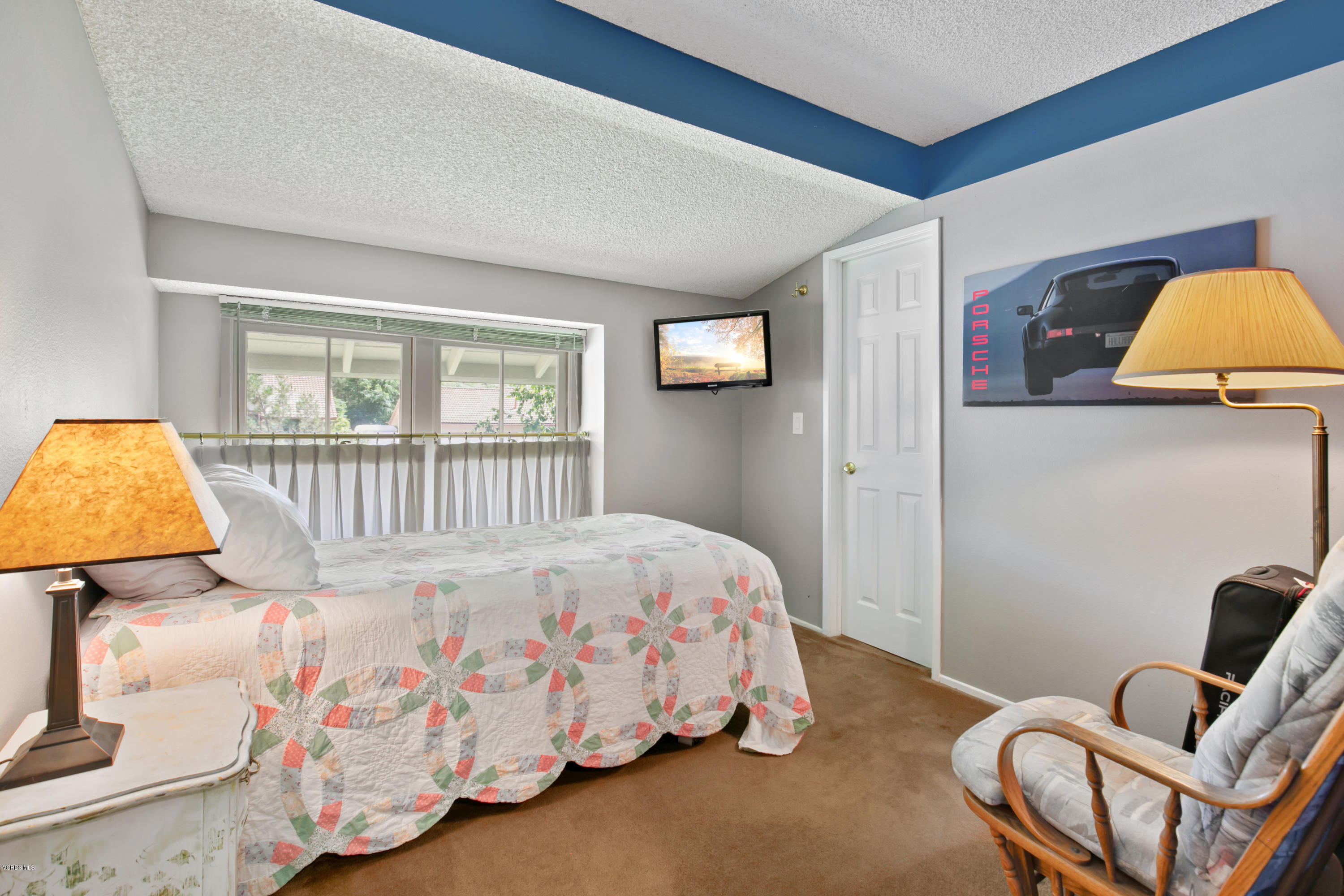 1291 Rambling Road Simi Valley, CA 93065 - Photo 23 of 75 a bedroom with a bed and wooden floor