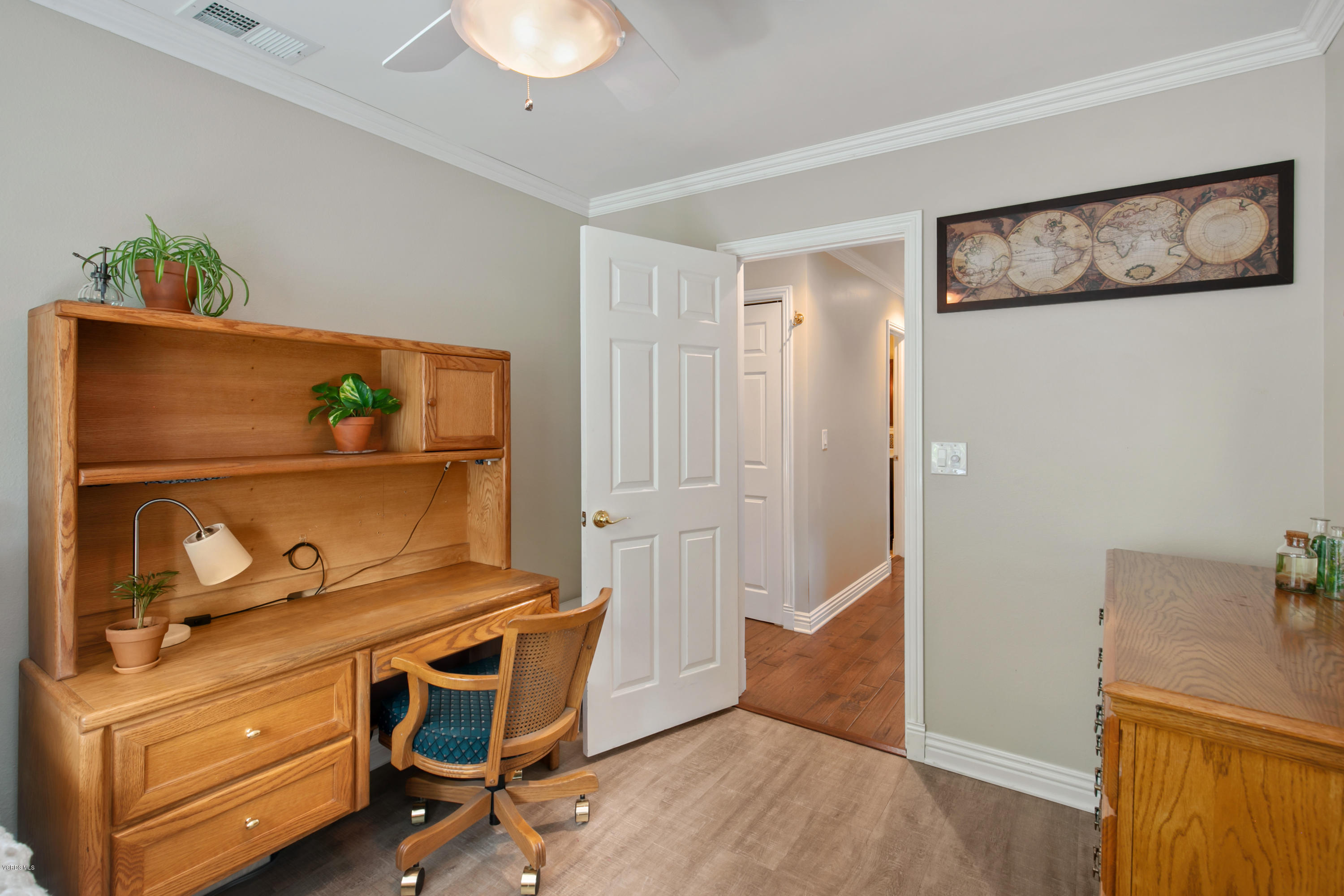 1291 Rambling Road Simi Valley, CA 93065 - Photo 26 of 75 a view of workspace with wooden floor and cabinet