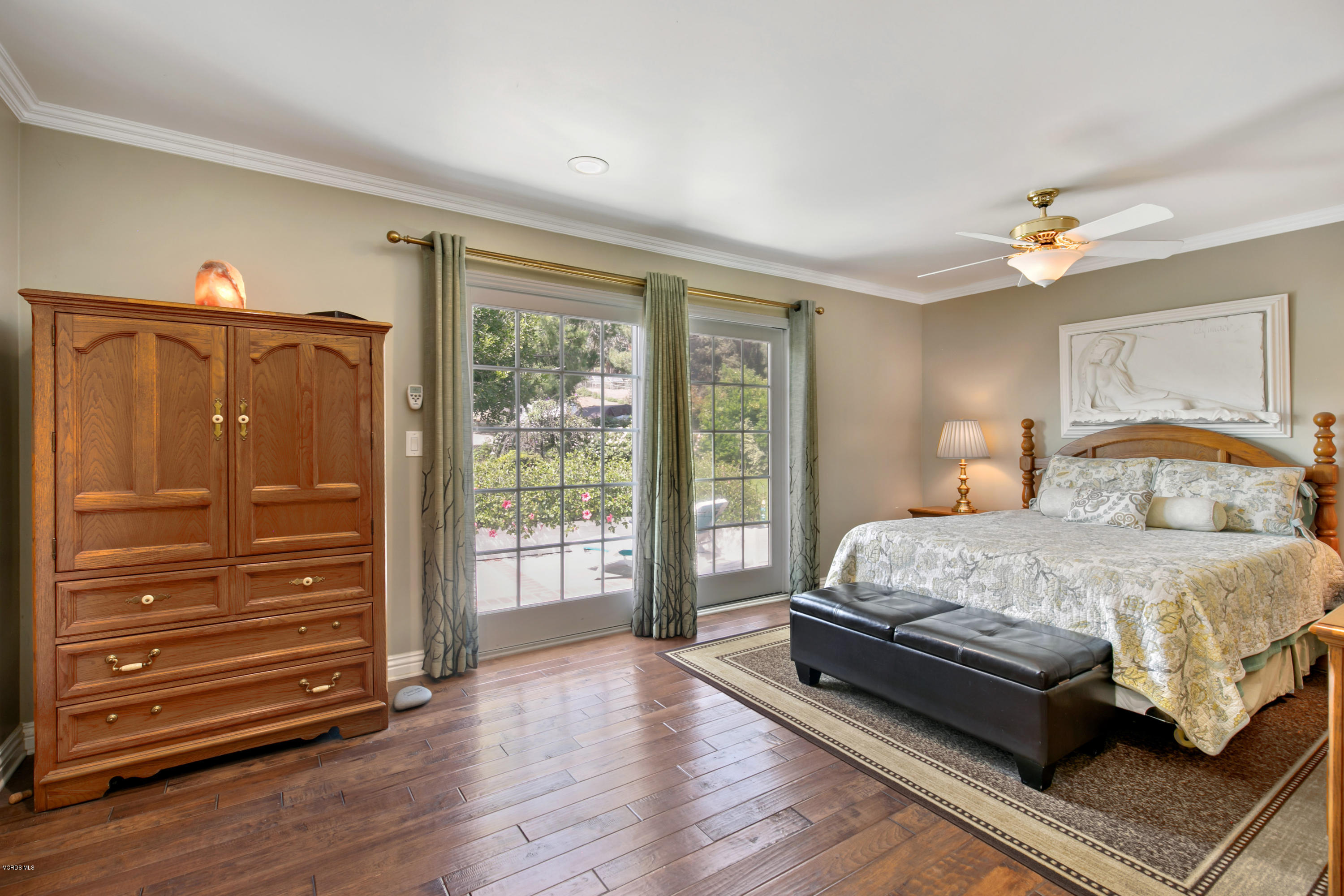 1291 Rambling Road Simi Valley, CA 93065 - Photo 27 of 75 a bedroom with a bed and wooden floor