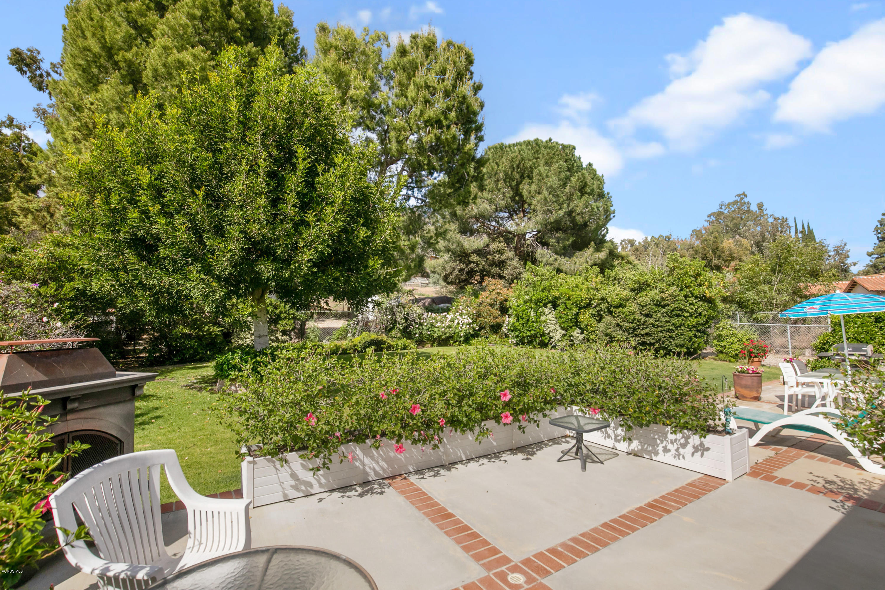 1291 Rambling Road Simi Valley, CA 93065 - Photo 37 of 75 a view of a patio with table and chairs and potted plants