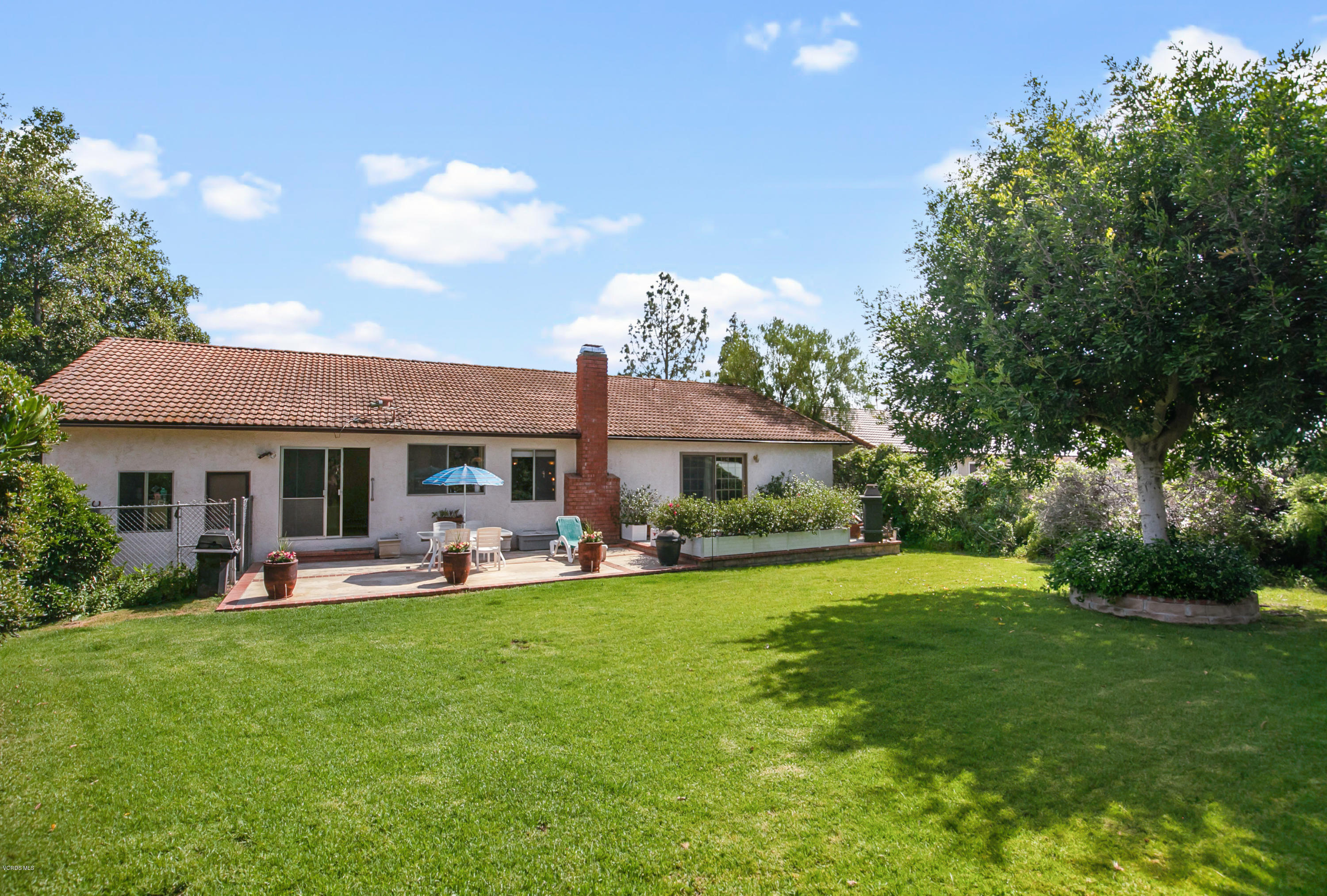 1291 Rambling Road Simi Valley, CA 93065 - Photo 40 of 75 a front view of a house with garden and trees
