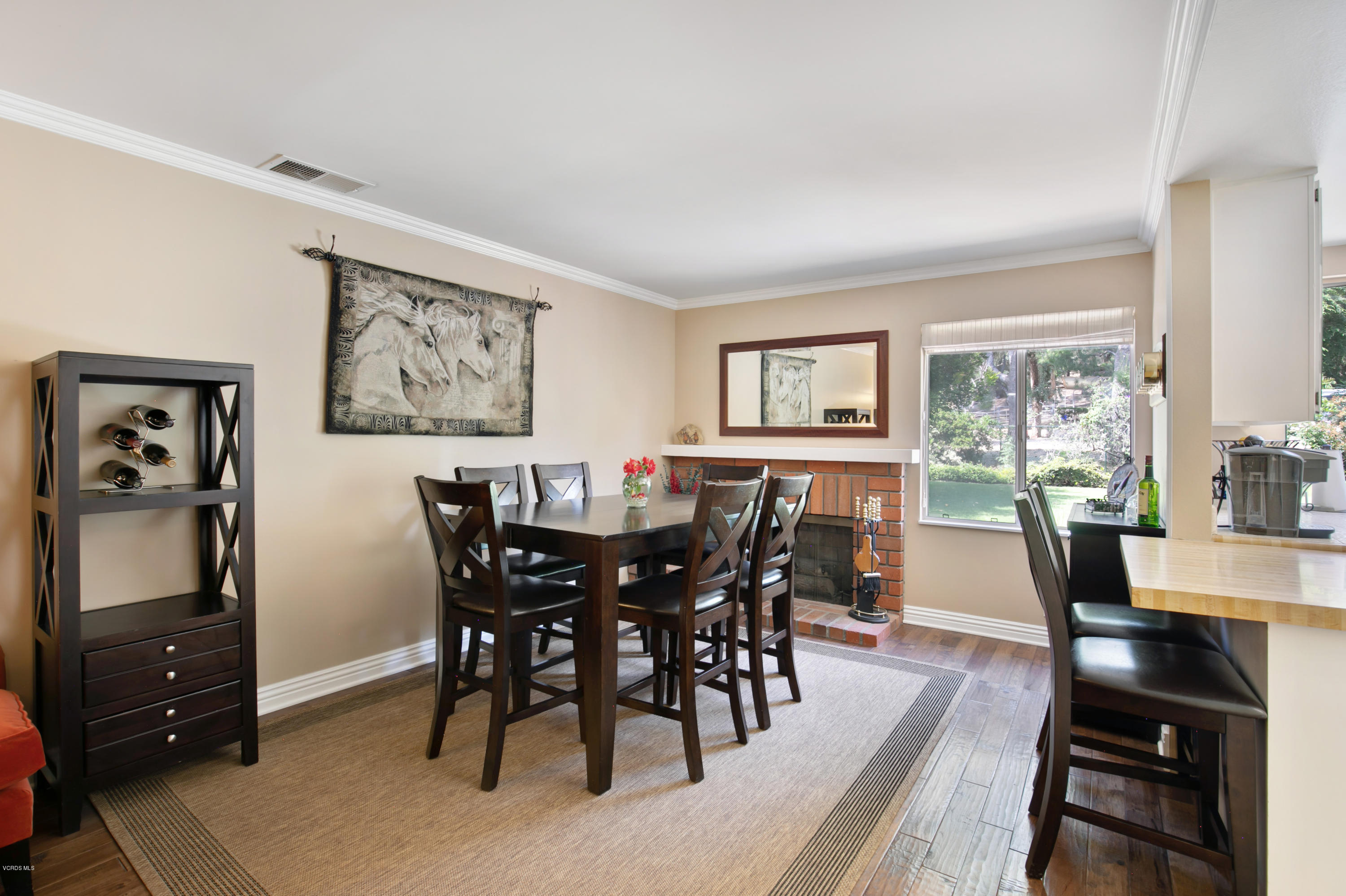 1291 Rambling Road Simi Valley, CA 93065 - Photo 5 of 75 a view of a dining room with furniture window and wooden floor