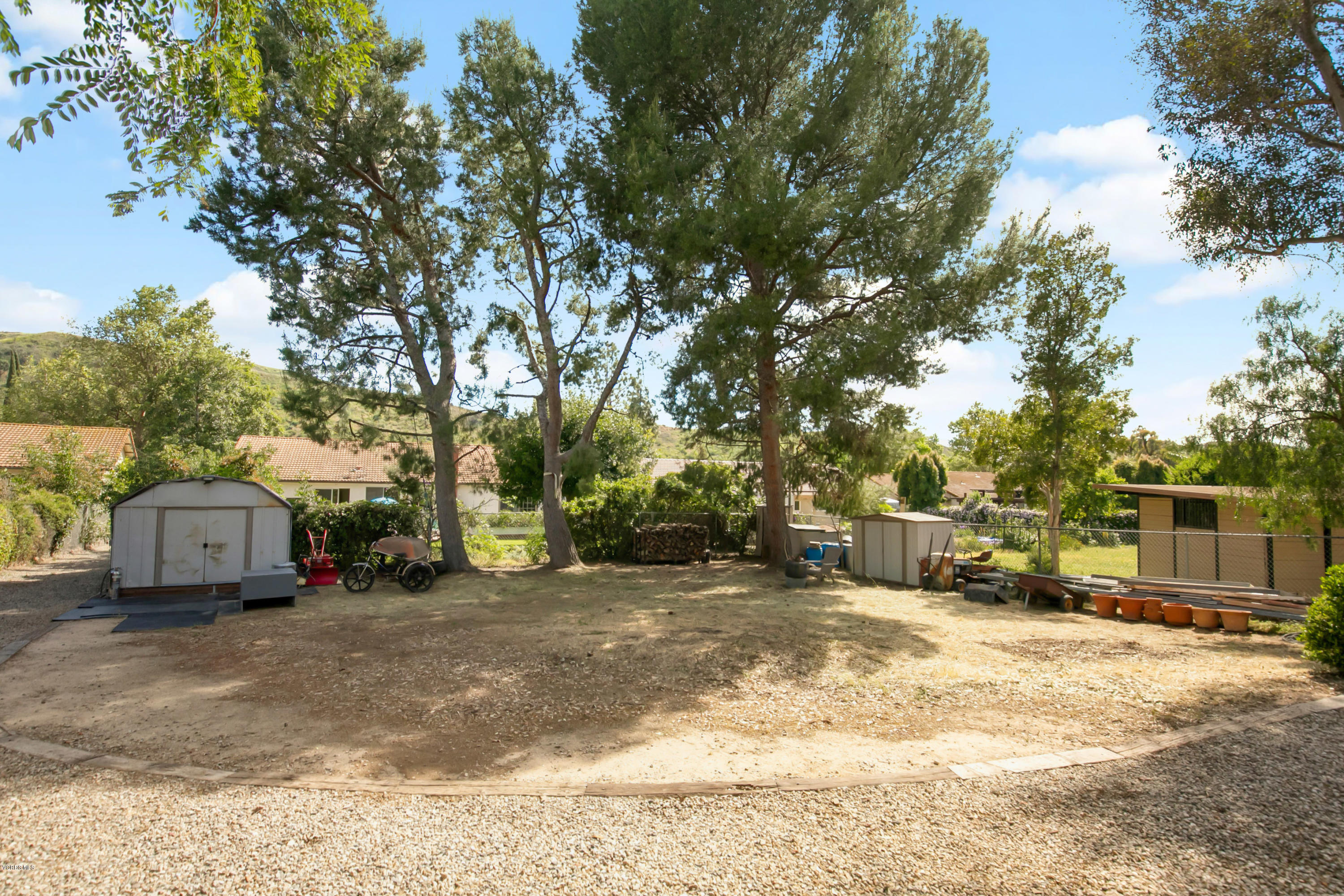 1291 Rambling Road Simi Valley, CA 93065 - Photo 47 of 75 a view of a house with a large tree in front of it
