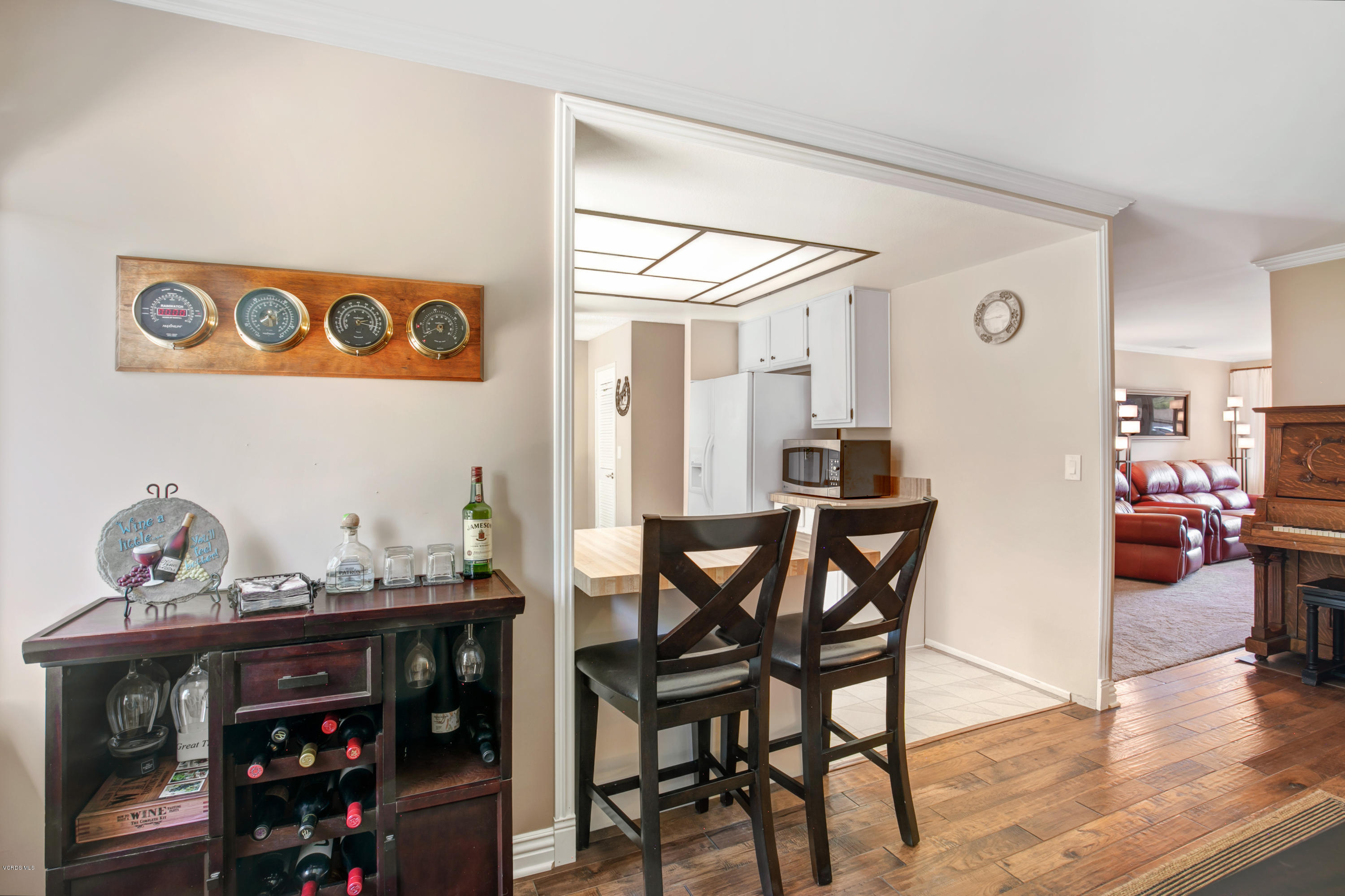 1291 Rambling Road Simi Valley, CA 93065 - Photo 7 of 75 a view of a dining room with furniture and wooden floor