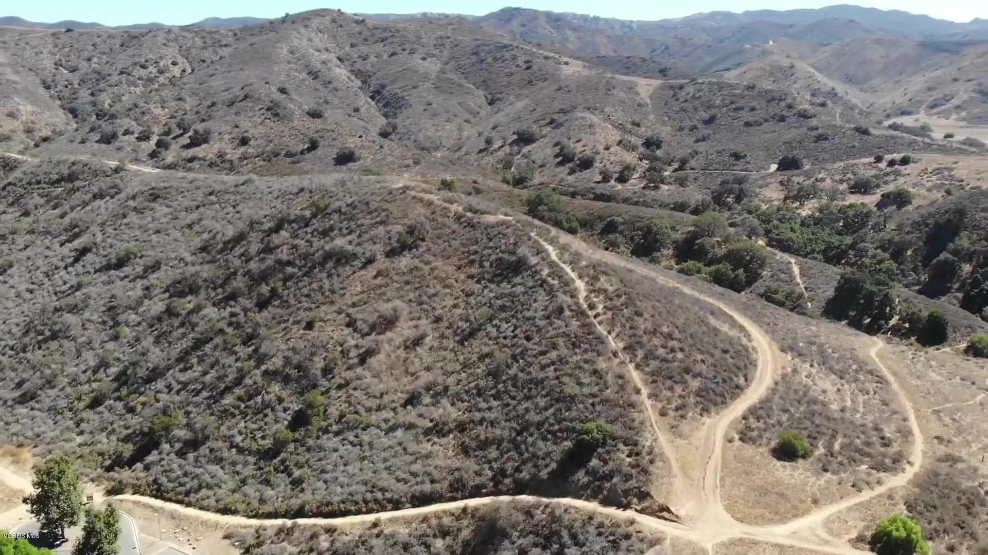 1291 Rambling Road Simi Valley, CA 93065 - Photo 73 of 75 a view of a dry yard with mountains in the background