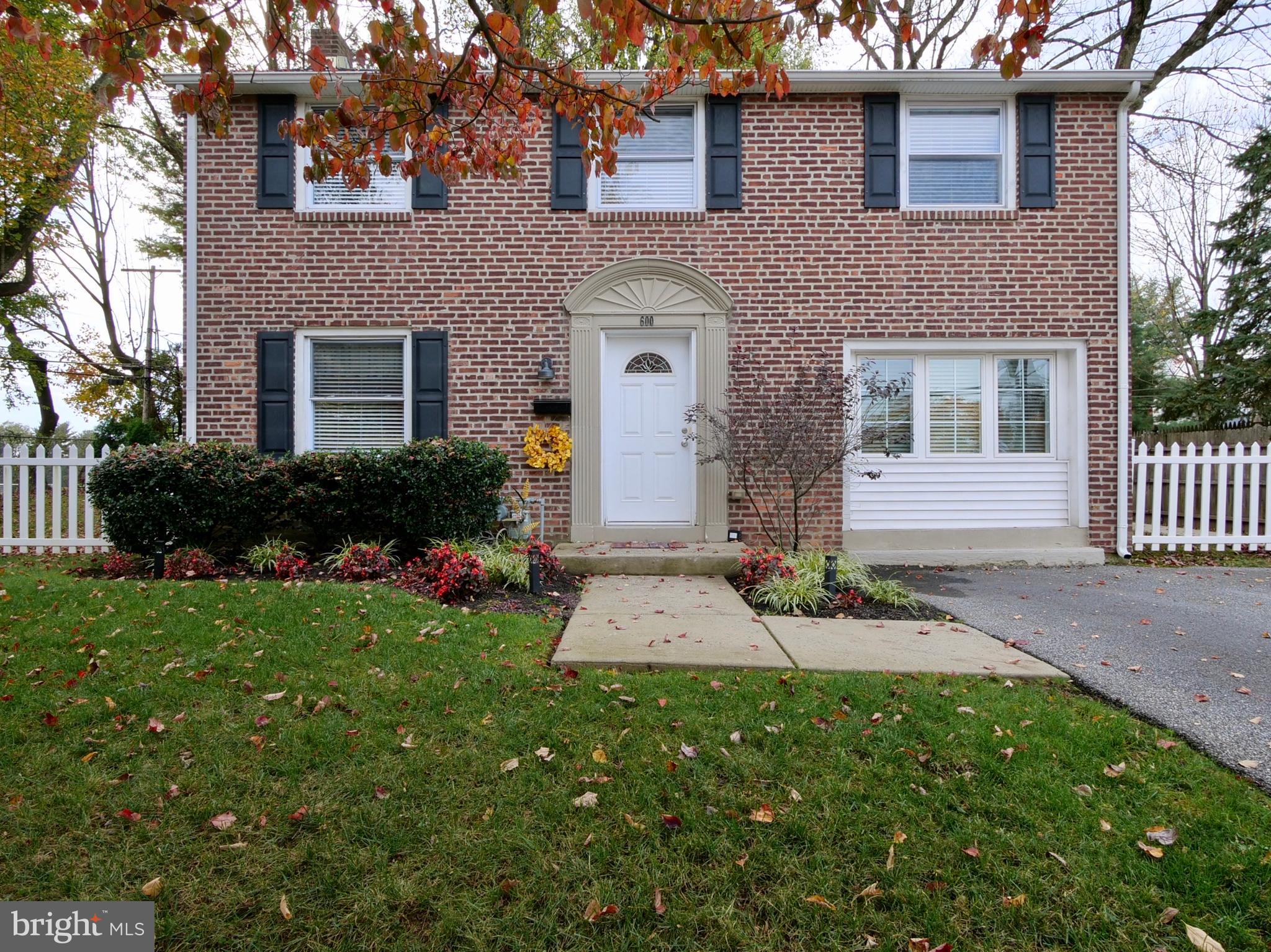 600 West Springfield Road Springfield, PA 19064 - Photo 1 of 28 a front view of a house with garden