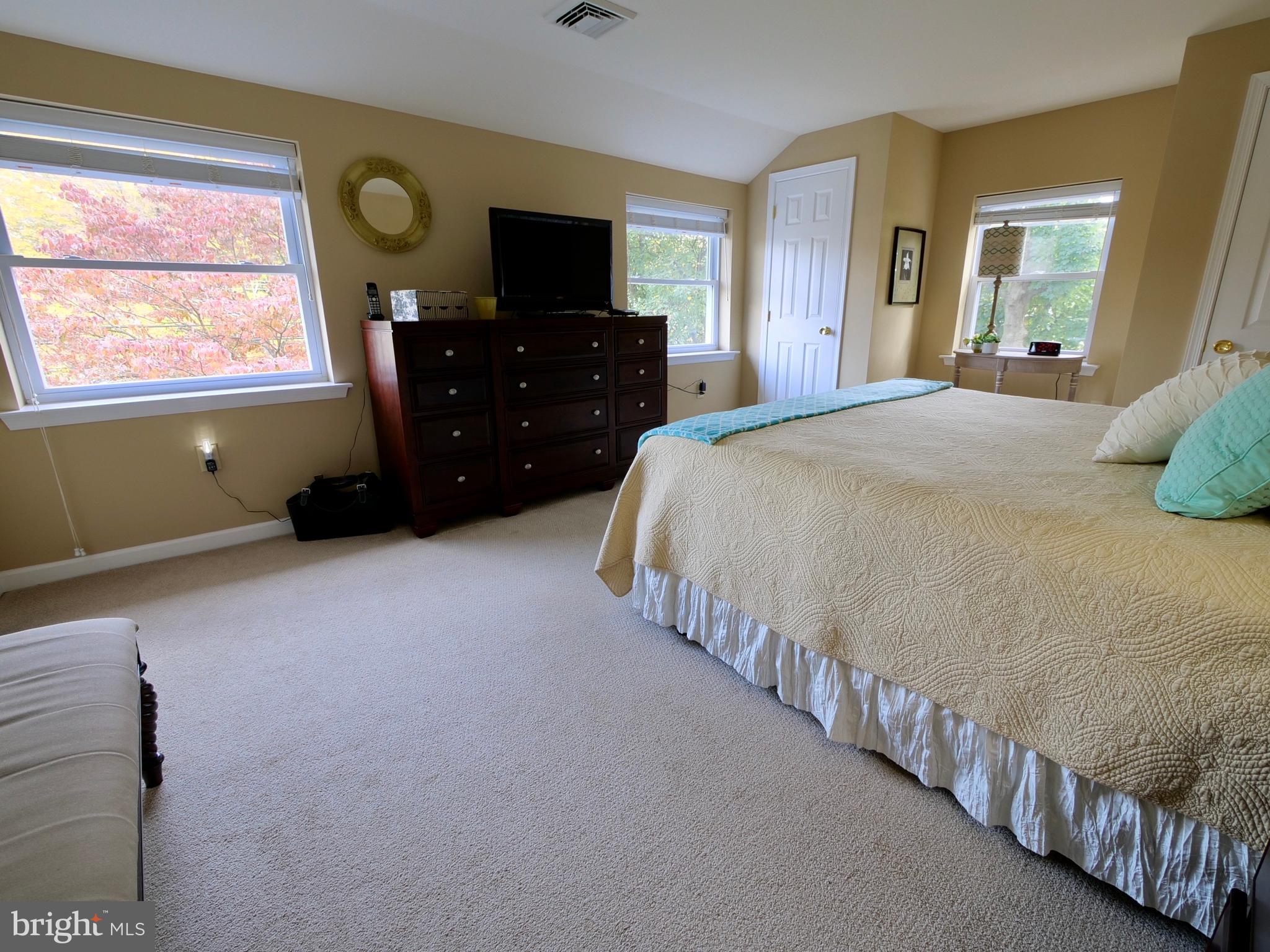 600 West Springfield Road Springfield, PA 19064 - Photo 14 of 28 a bedroom with double bed and a window