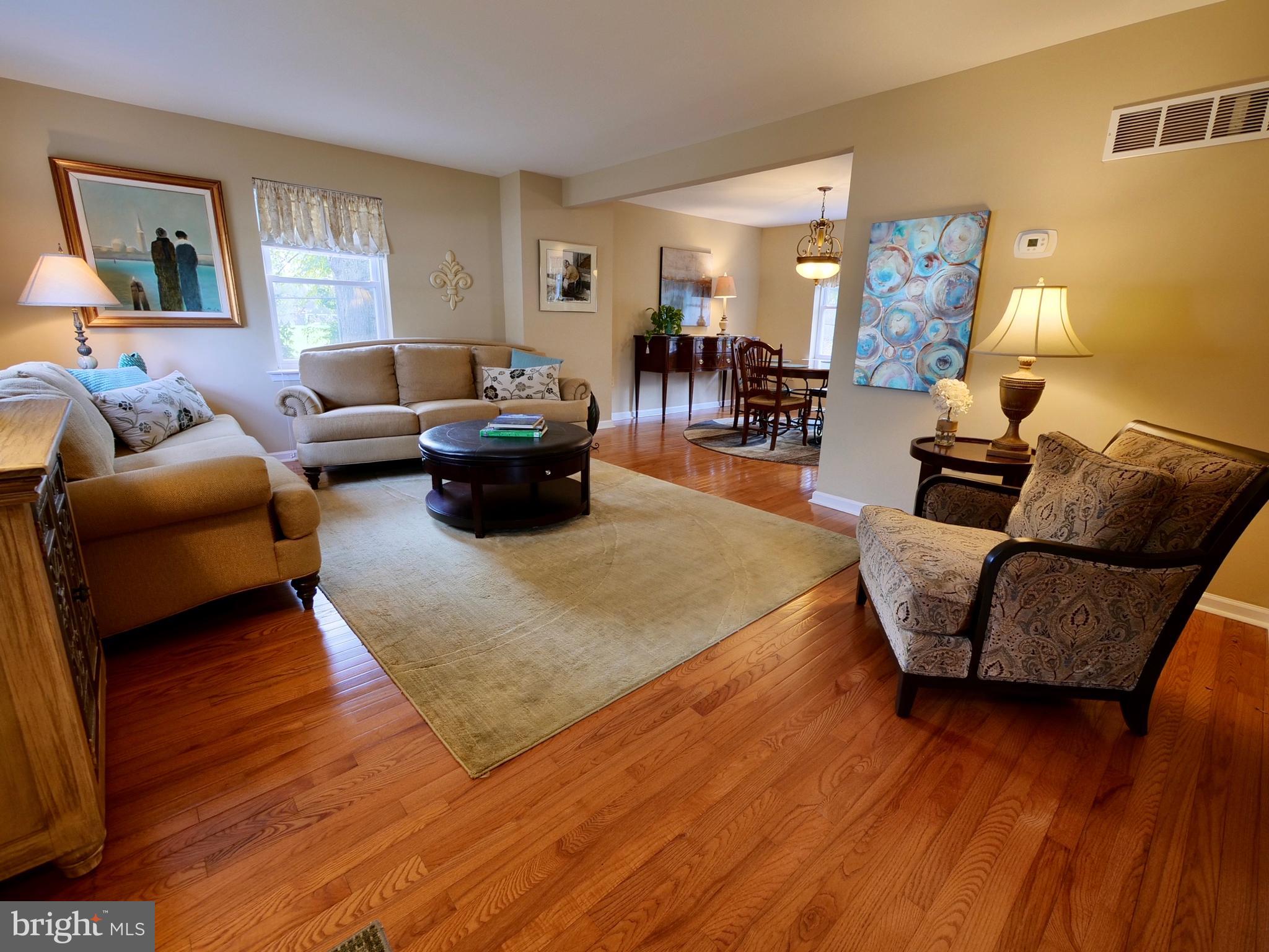 600 West Springfield Road Springfield, PA 19064 - Photo 3 of 28 a living room with furniture and a wooden floor