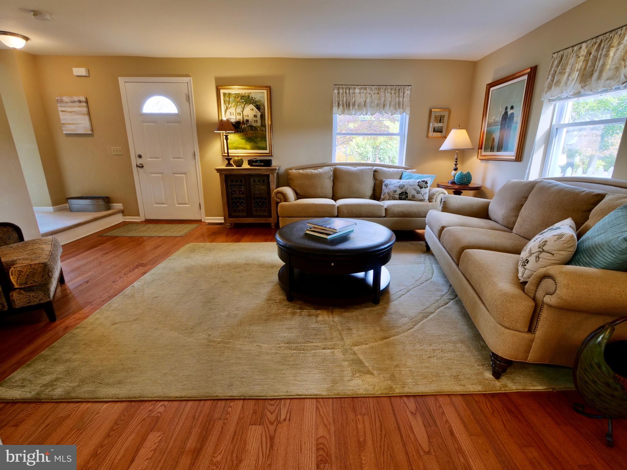 600 West Springfield Road Springfield, PA 19064 - Photo 4 of 28 a living room with furniture and a fireplace