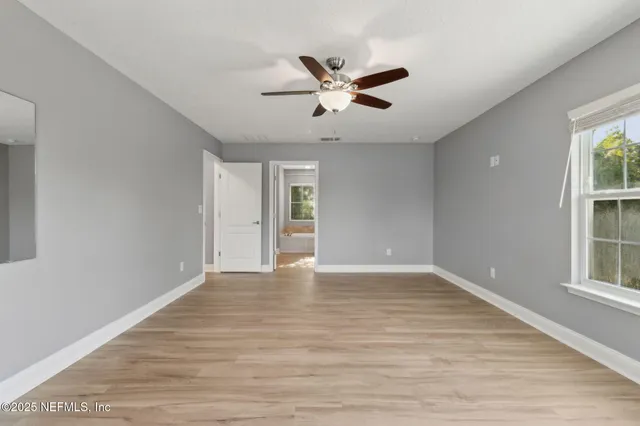 a white bath tub sitting next to a window