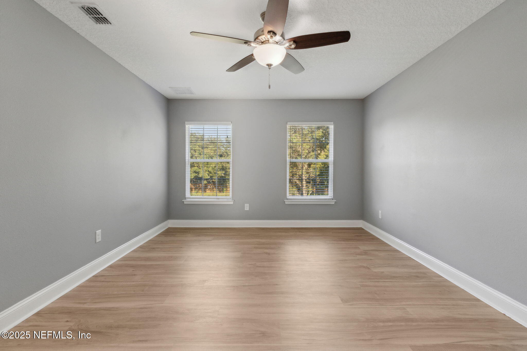 16199 Shellcracker Road Jacksonville, FL 32226 - Photo 18 of 40 wooden floor in an empty room with a window