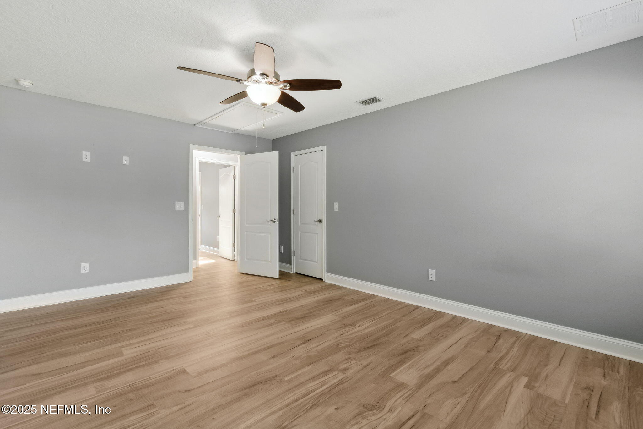16199 Shellcracker Road Jacksonville, FL 32226 - Photo 21 of 40 wooden floor in an empty room with a window