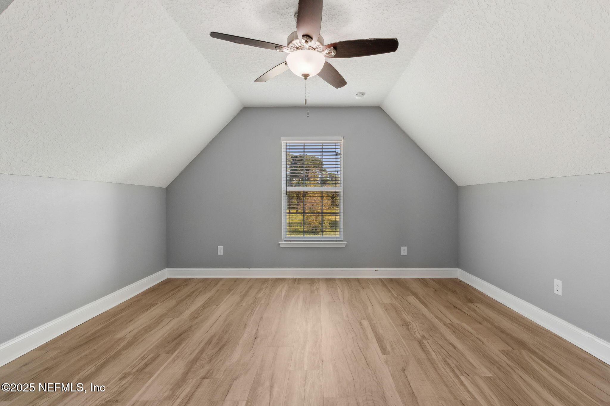 16199 Shellcracker Road Jacksonville, FL 32226 - Photo 25 of 40 wooden floor in an empty room with a window