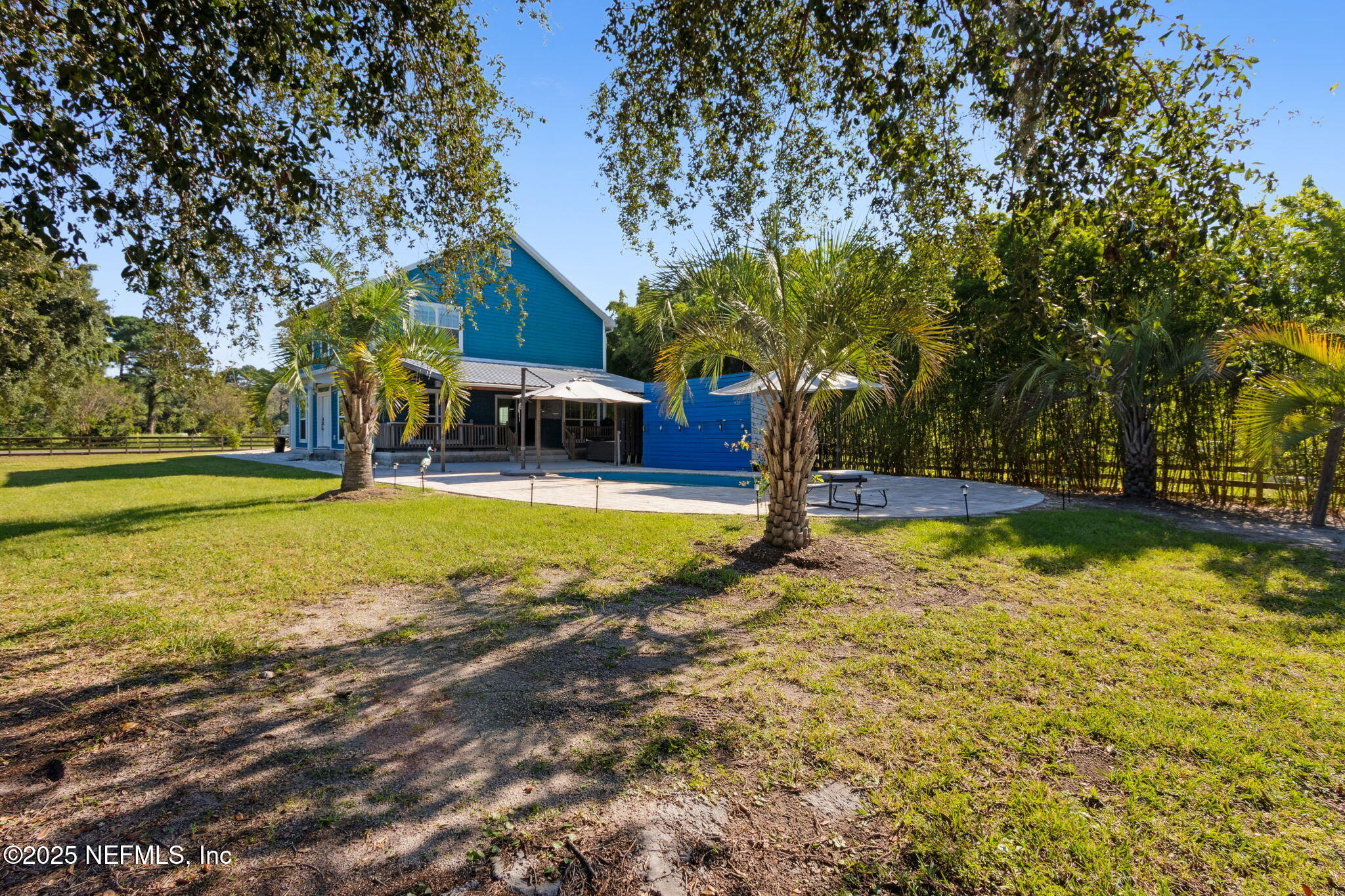 16199 Shellcracker Road Jacksonville, FL 32226 - Photo 35 of 40 a view of a swimming pool with an outdoor space and seating area